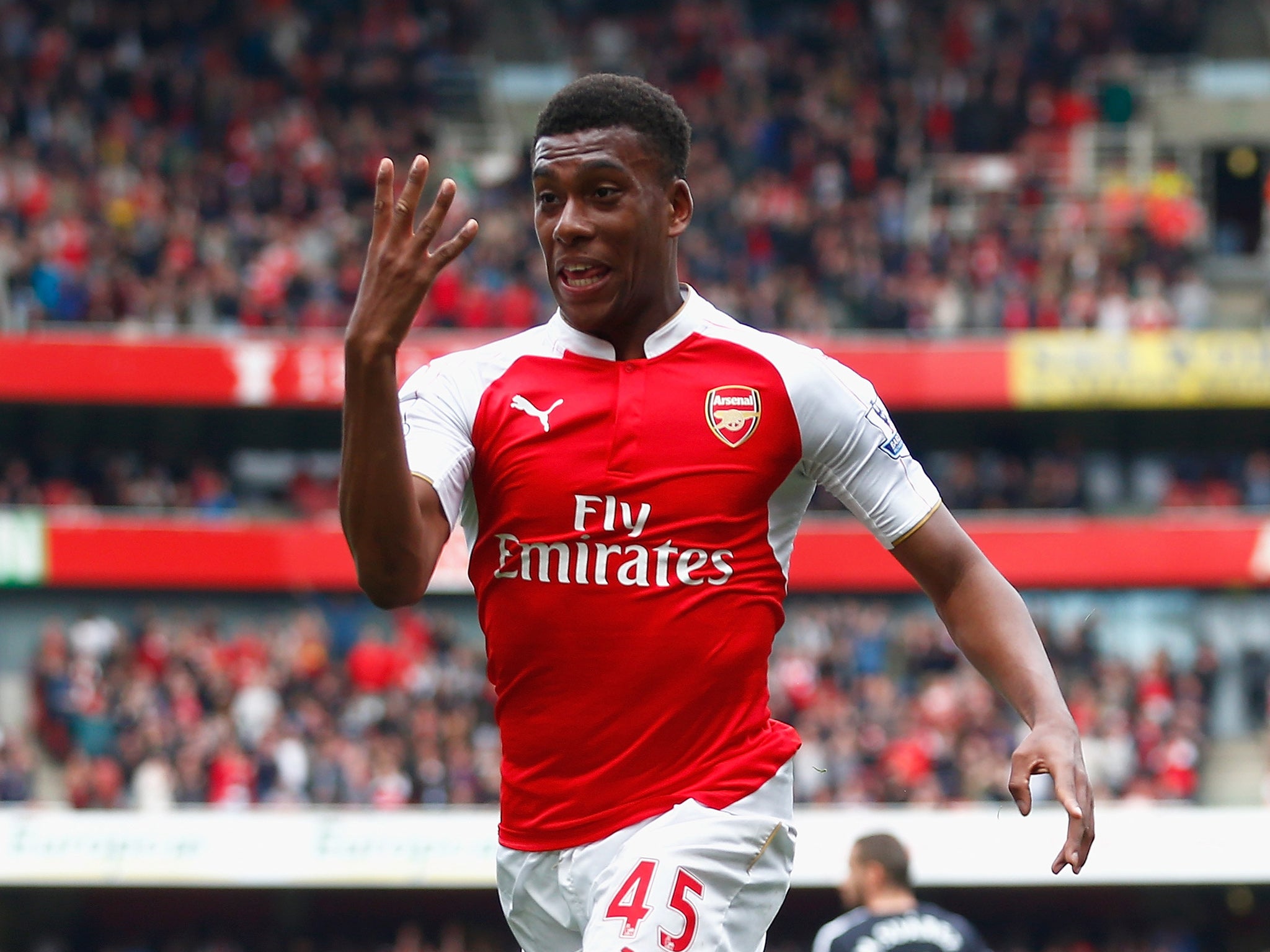 Alex Iwobi celebrates his goal for Arsenal against Watford