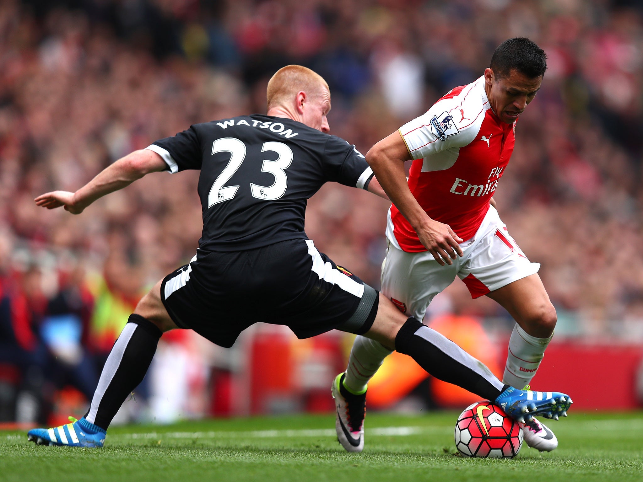 Ben Watson attempts to rob Alexis Sanchez of possession