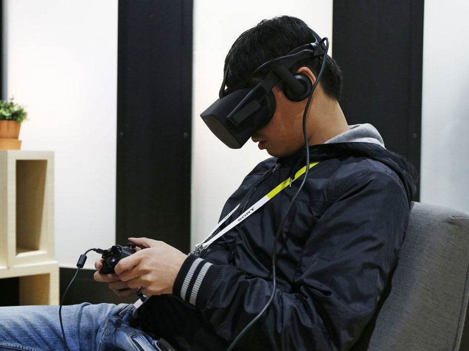 A man uses the Oculus Rift at CES in Las Vegas