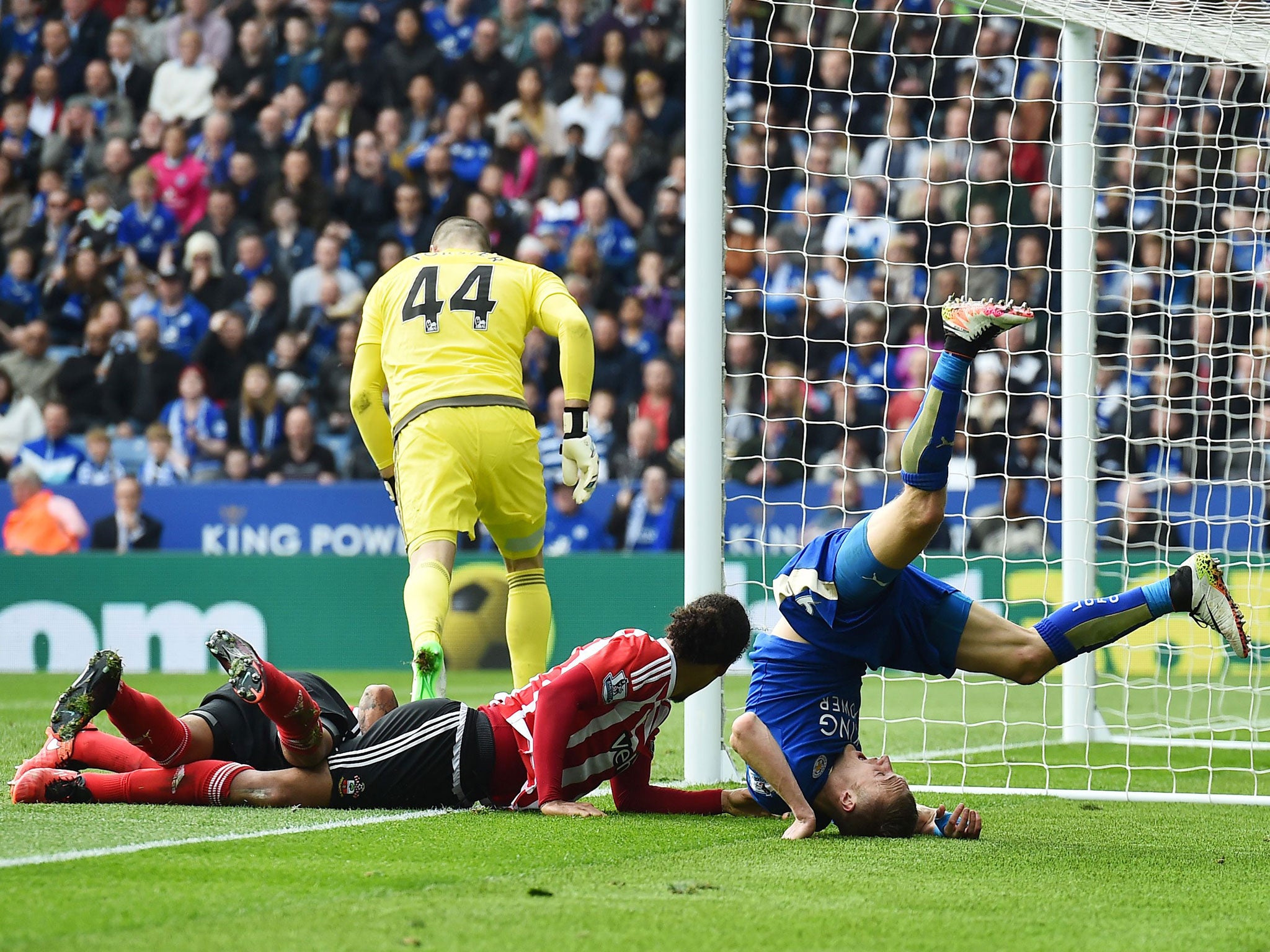 Jamie Vardy tumbles off the pitch