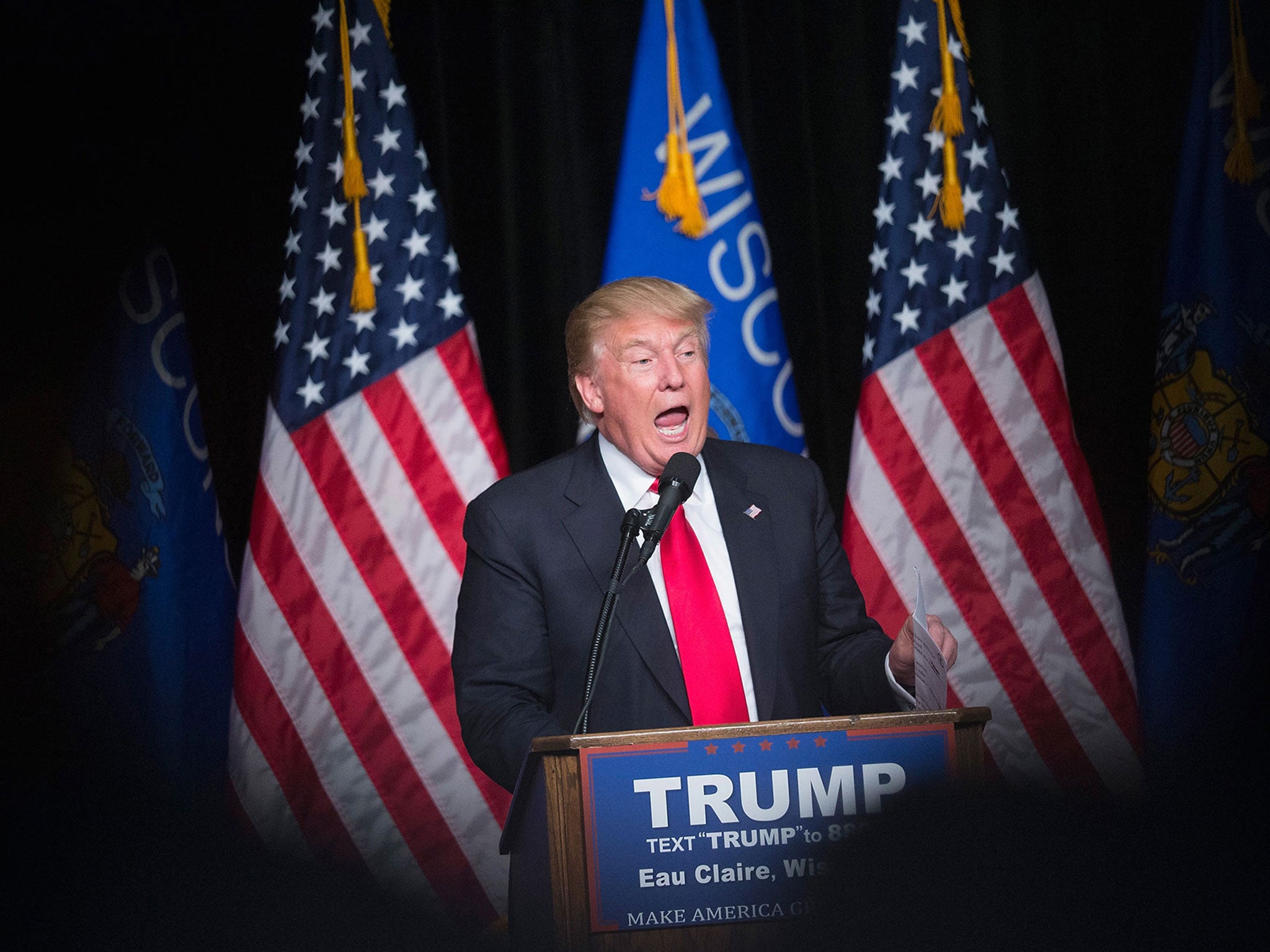 Republican presidential candidate Donald Trump speaks to guests during a campaign stop at Memorial High School in Eau Claire, Wisconsin