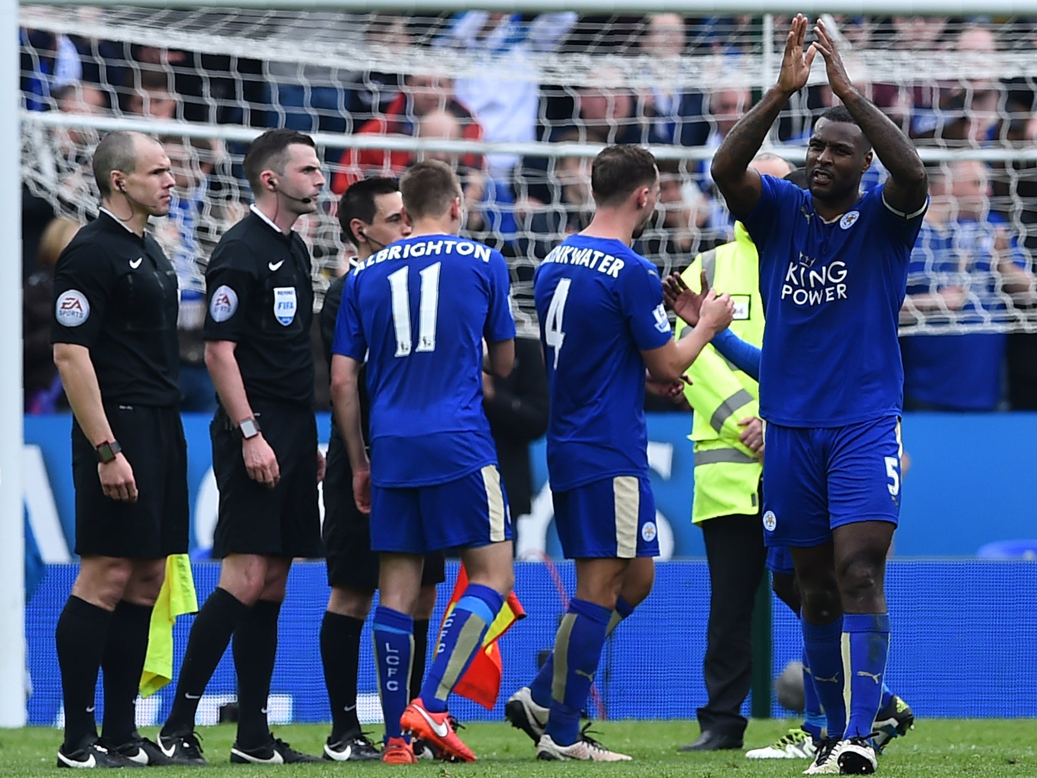 Wes Morgan (far right) applauds the home fans after the final whistle