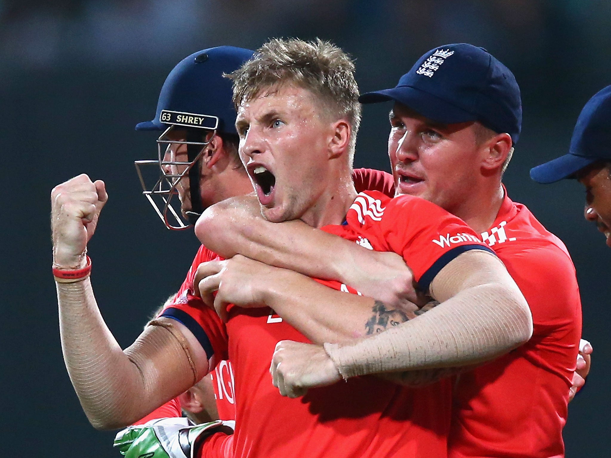 Joe Root celebrates taking the wicket of Chris Gayle