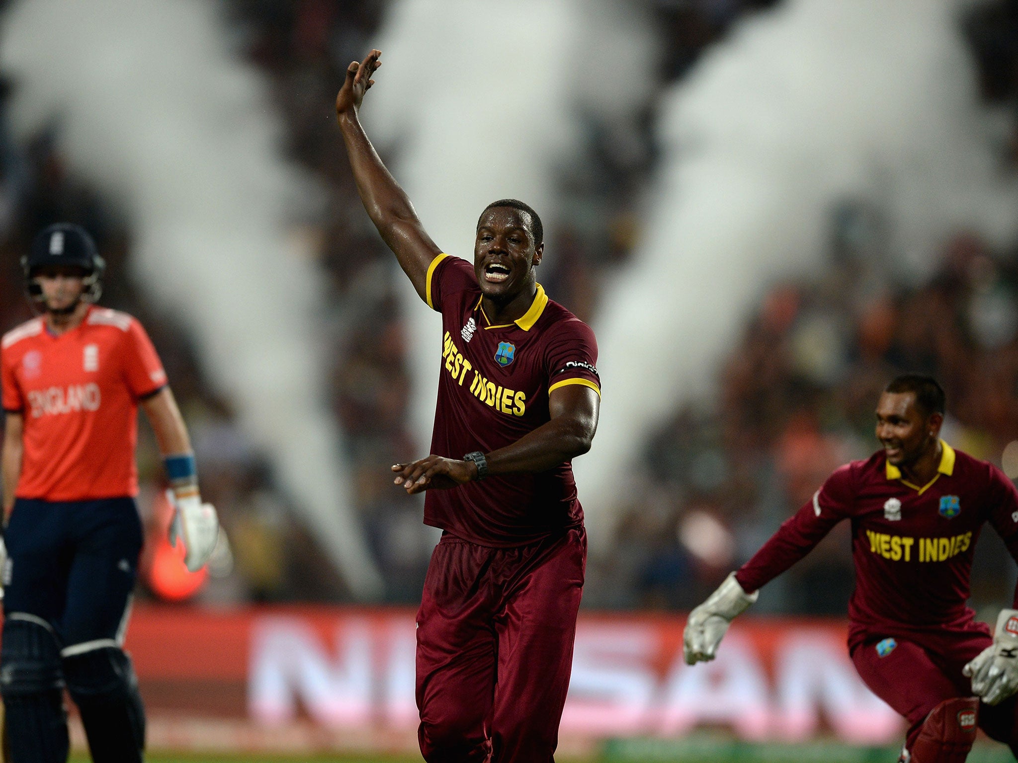 Carlos Brathwaite of the West Indies celebrates dismissing Joe Root