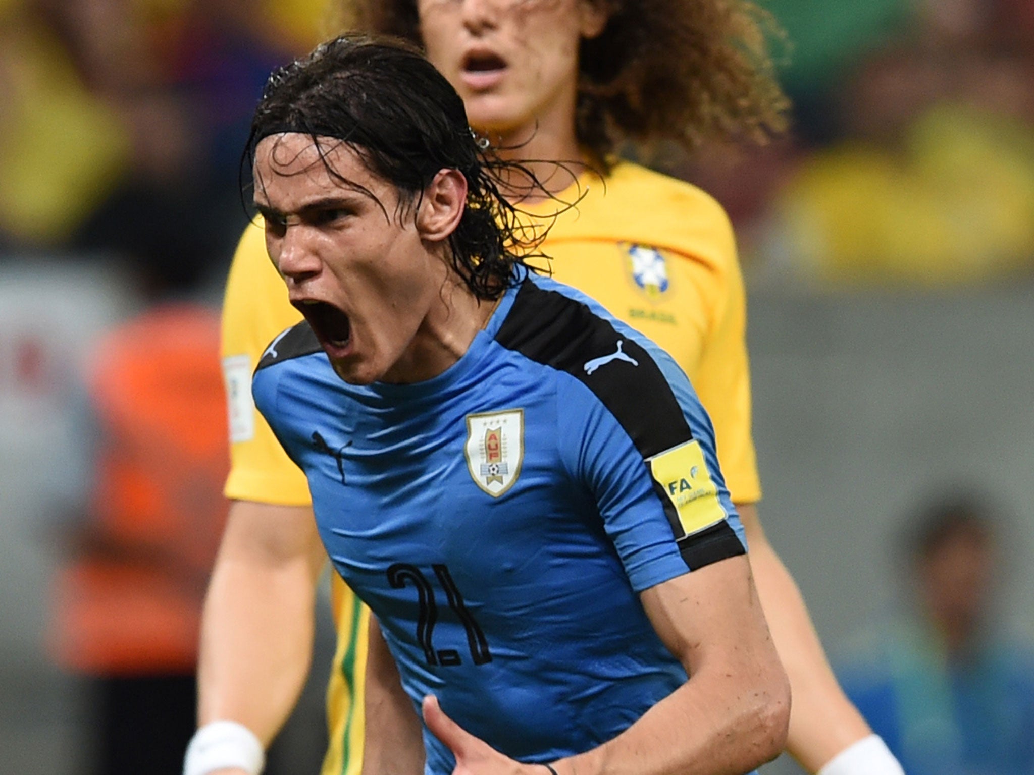 Edinson Cavani celebrates scoring for Uruguay against Brazil