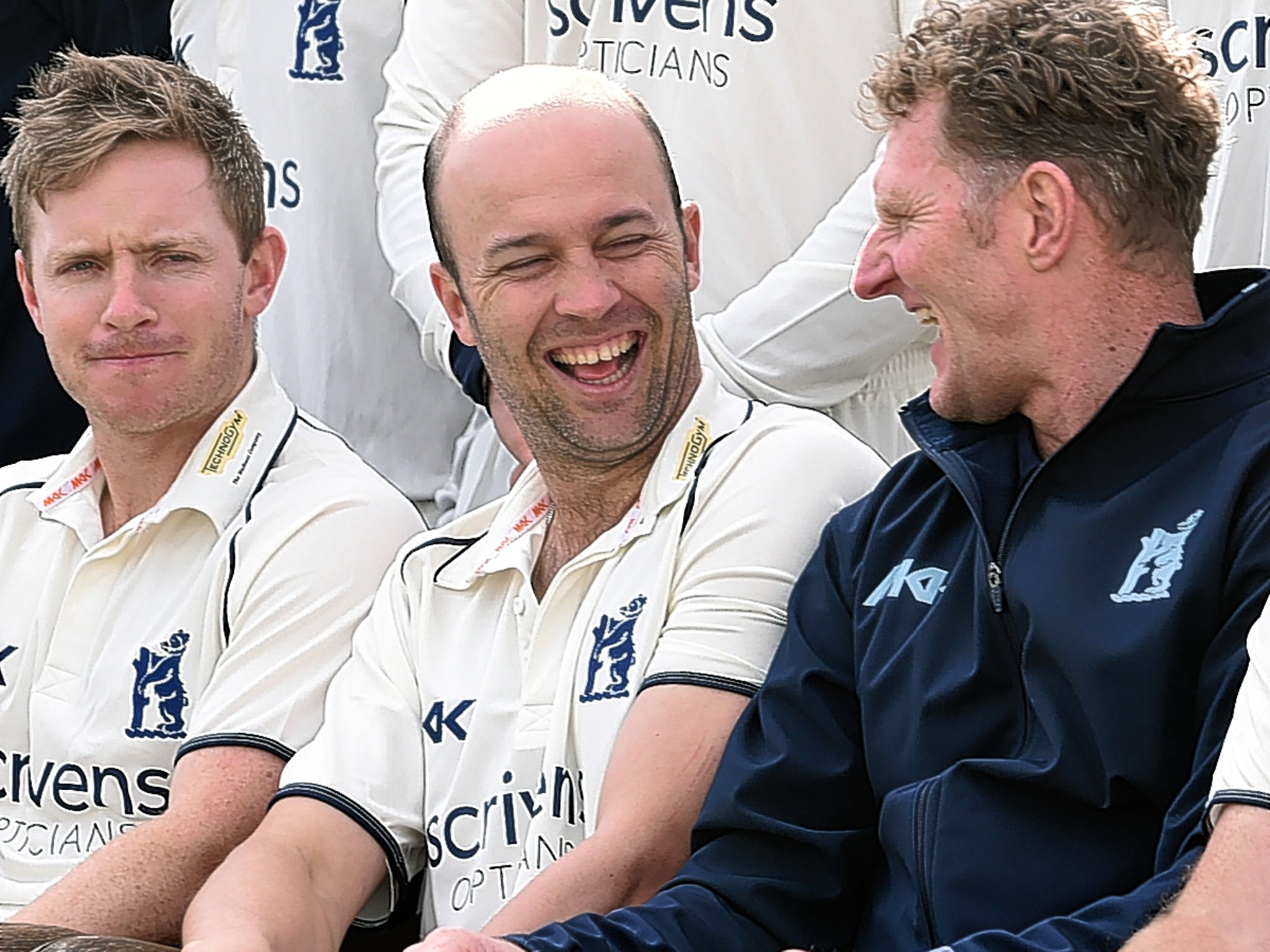 Jonathan Trott (centre) enjoys a laugh during the Warwickshire team photo