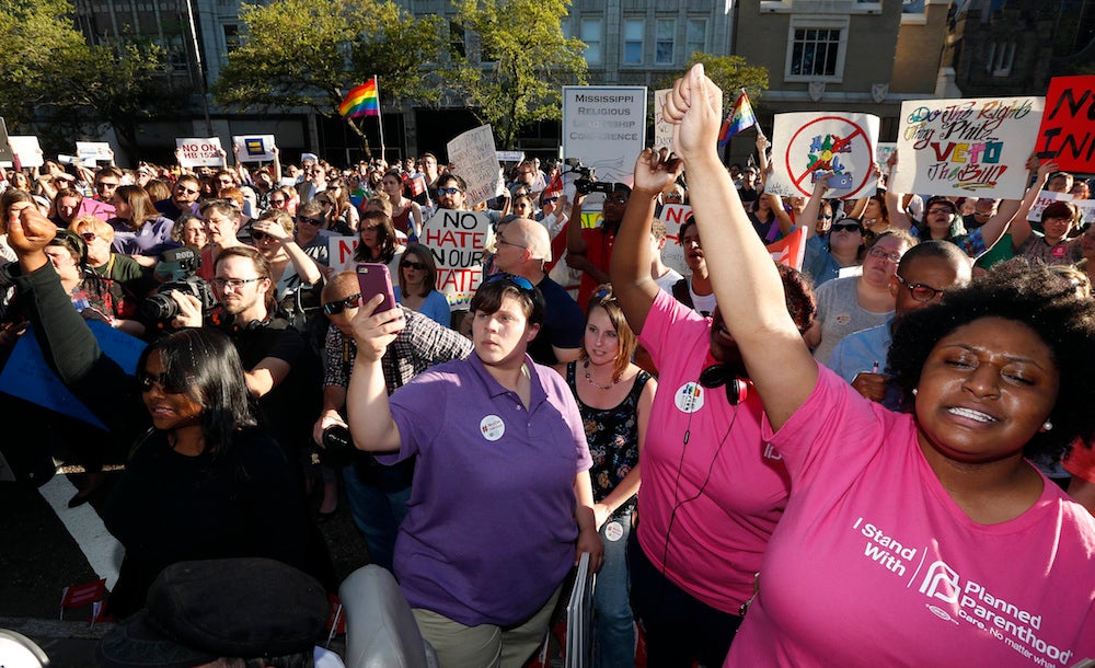 Protesters line up outside the Governor's Mansion in Mississippi on April 4.