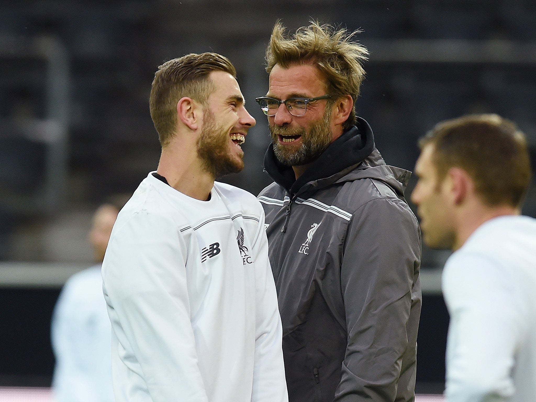 Jordan Henderson and Jurgen Klopp share a joke during training