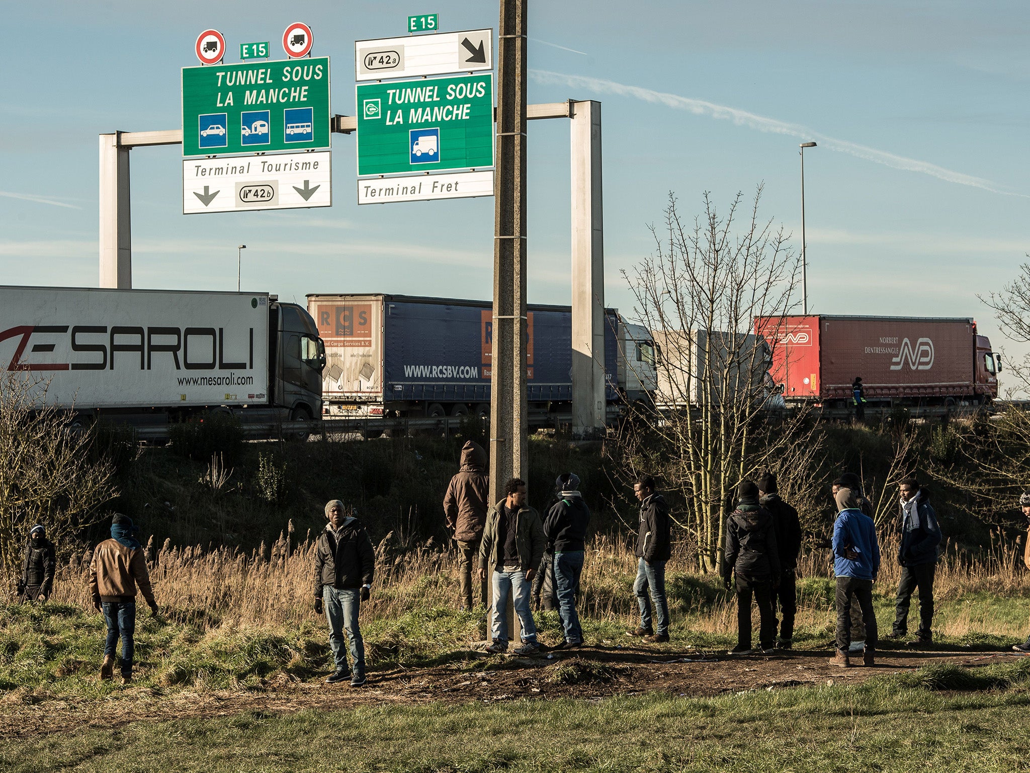 Refugees in Calais attempting to get on board lorries ending to the UK (file photo)