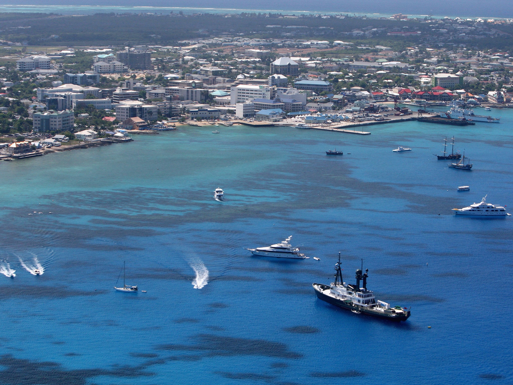 Both the Cayman Islands (pictured) and the British Virgin Islands are British Overseas Territories and receive defence and foreign affairs support from the UK