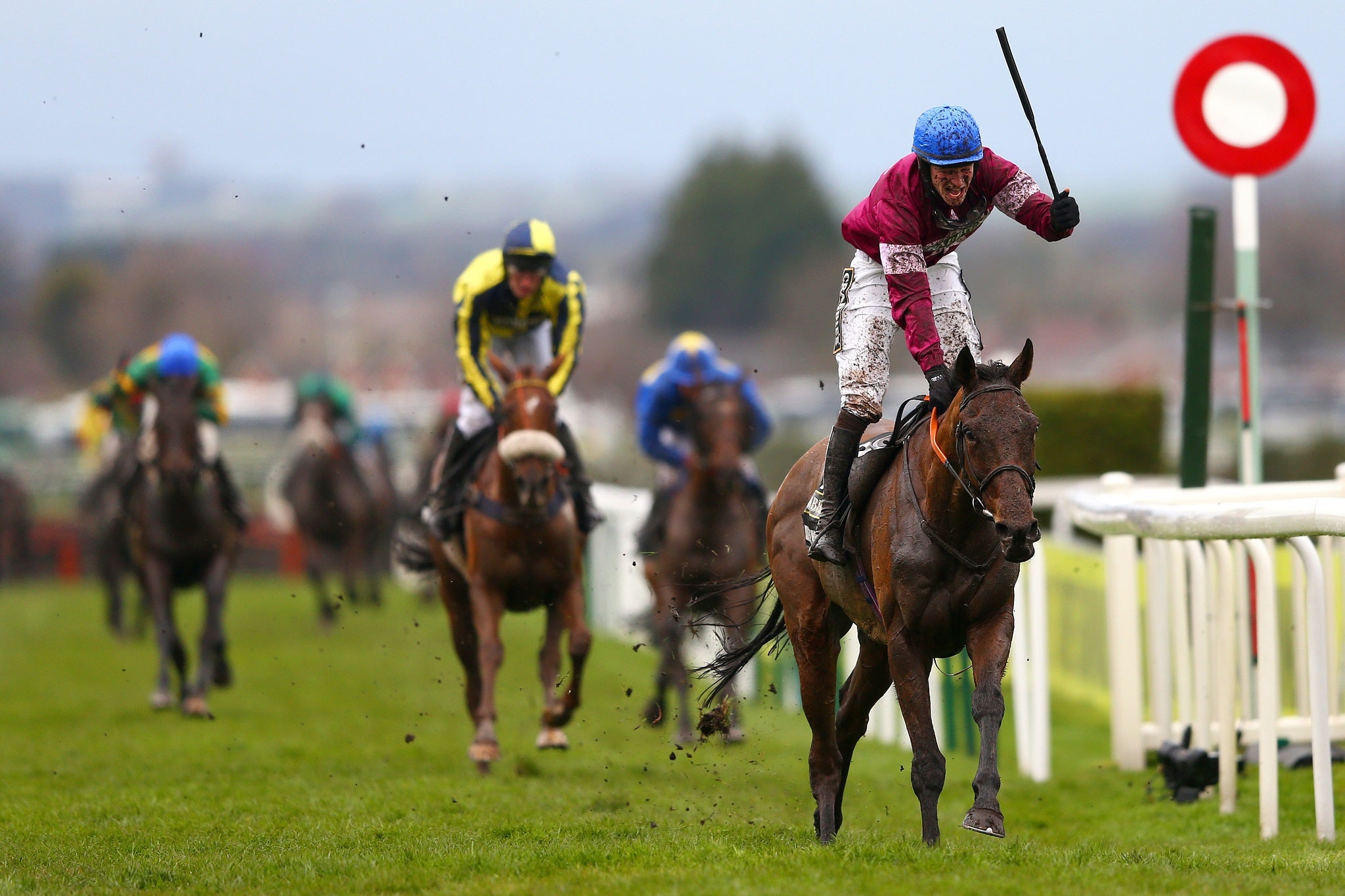 David Mullins celebrates winning the Grand National on Rule The World