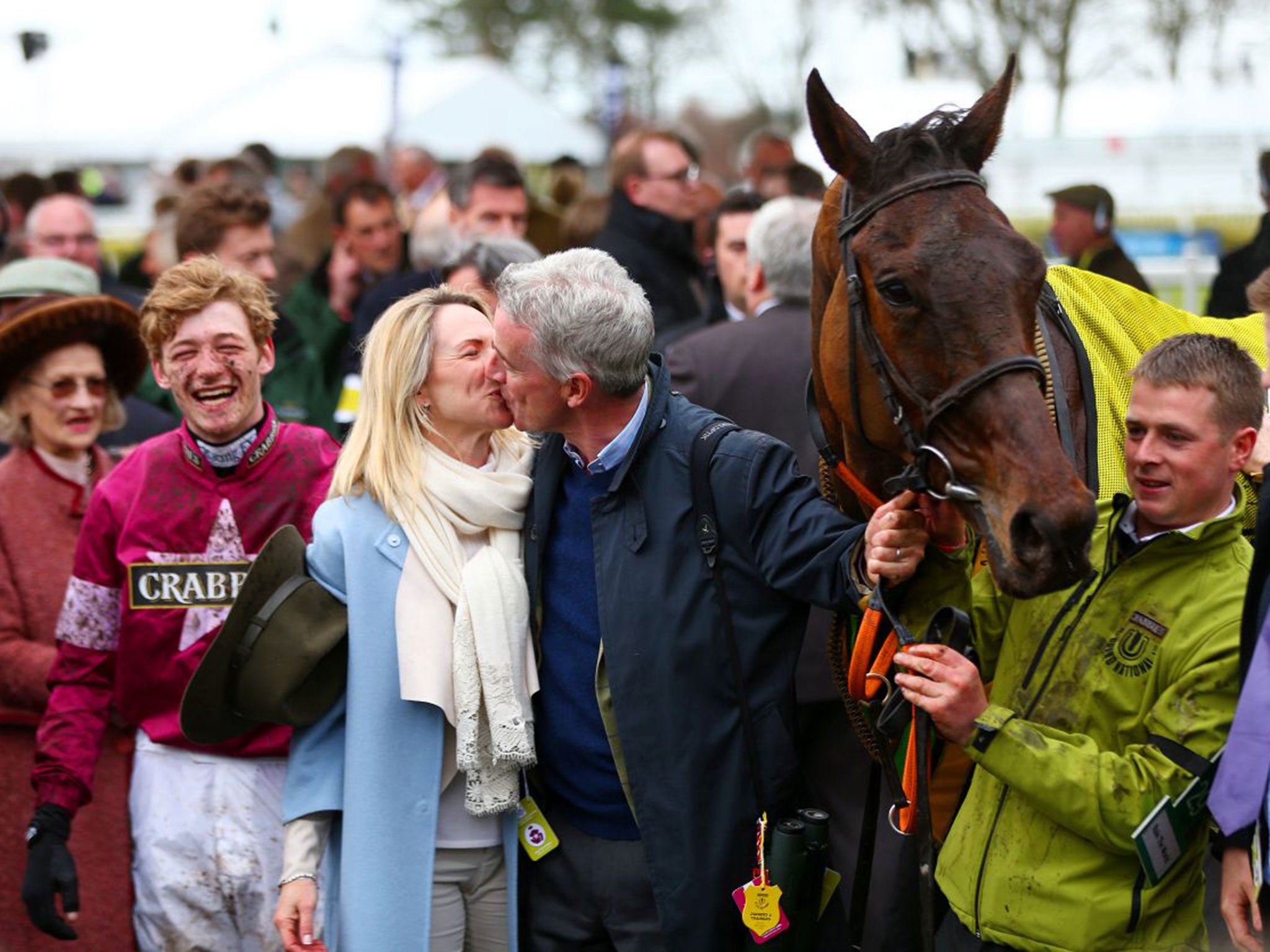 Owner Michael O'Leary celebrates with his wife Anita, with jockey David Mullins all smiles after riding Rule The World to victory in the 2016 Crabbie's Grand National at Aintree