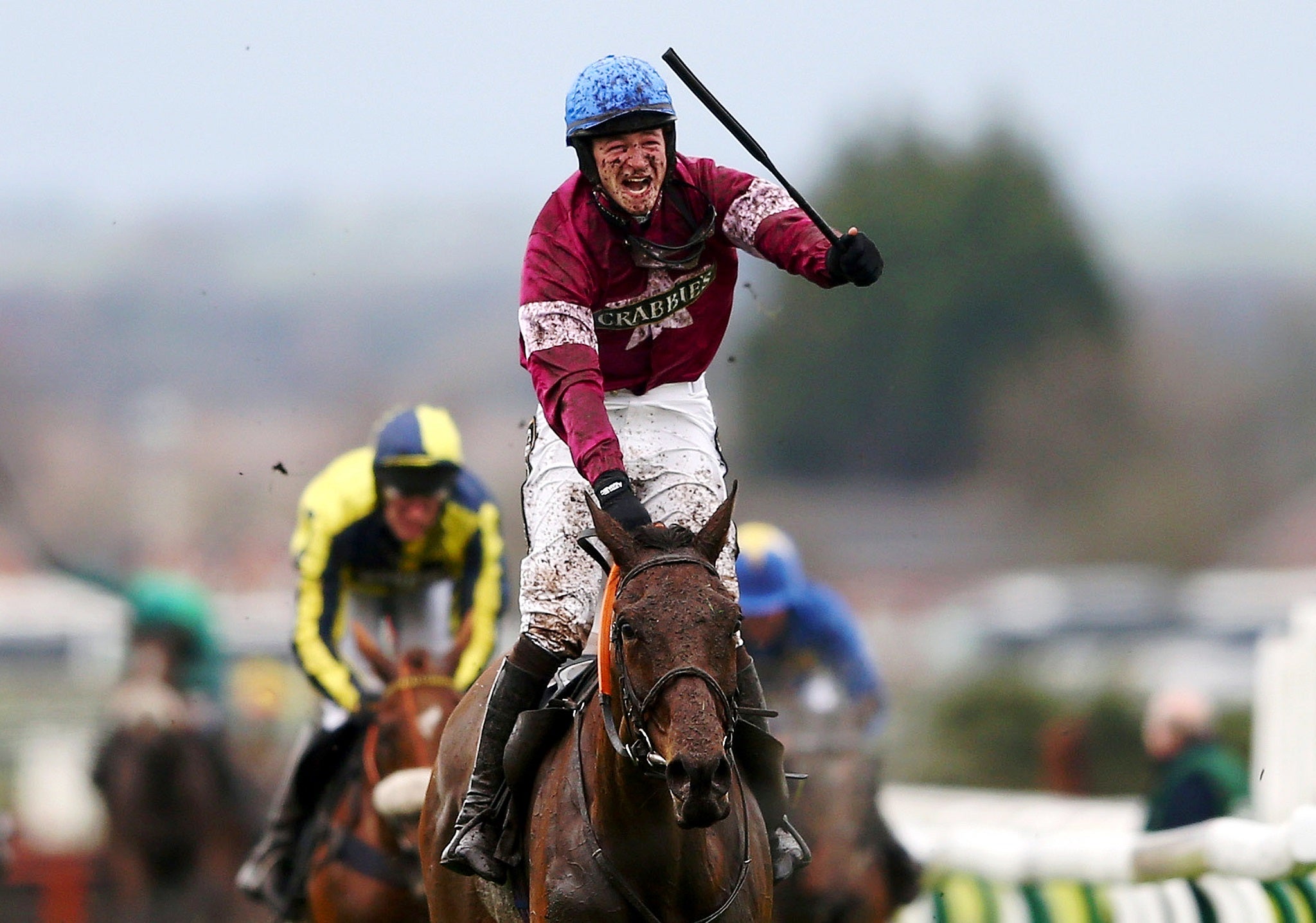 David Mullins celebrates after winning the Grand National on Rule The World