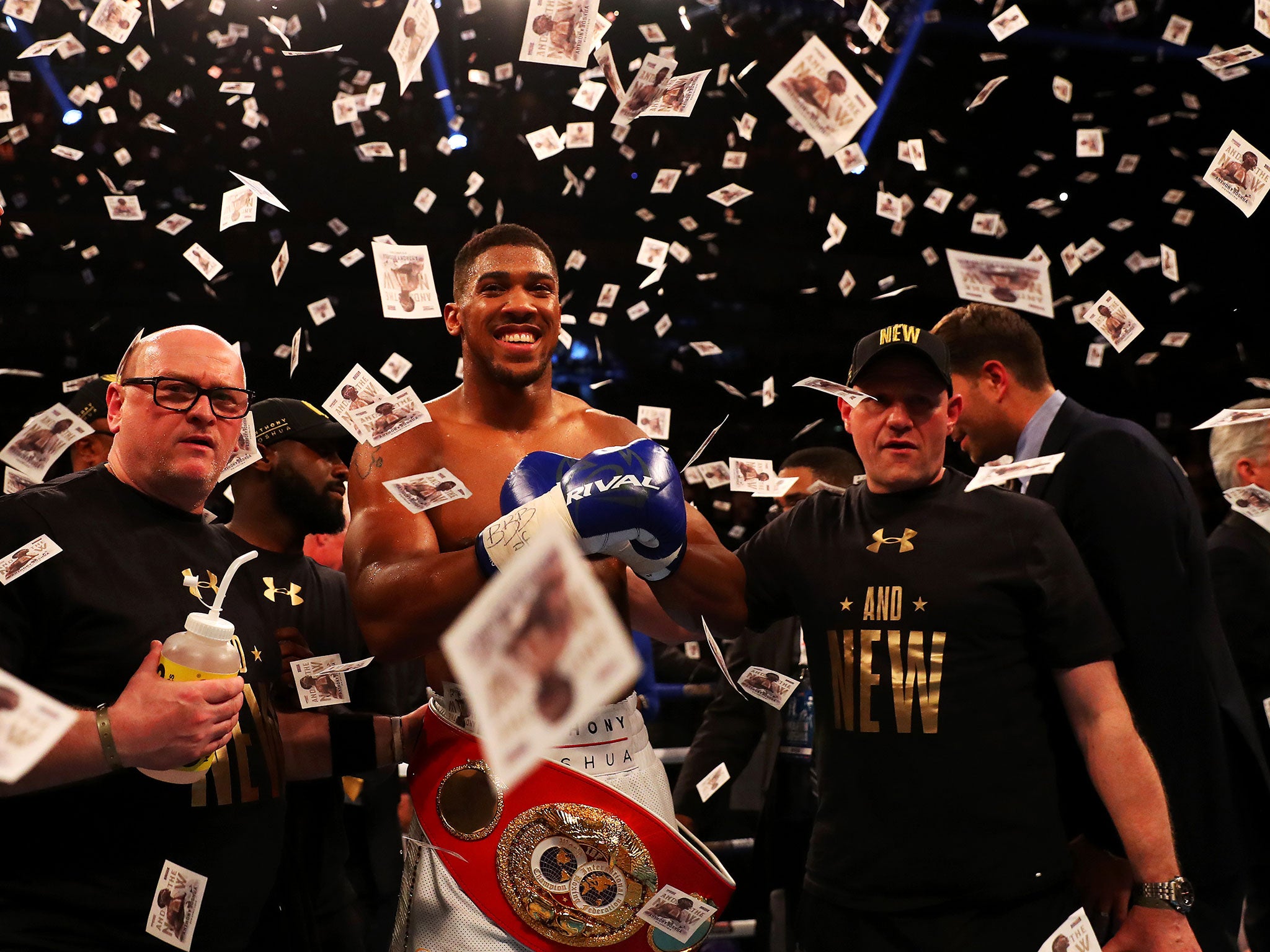 Anthony Joshua celebrates winning the IBF heavyweight championship inside two rounds