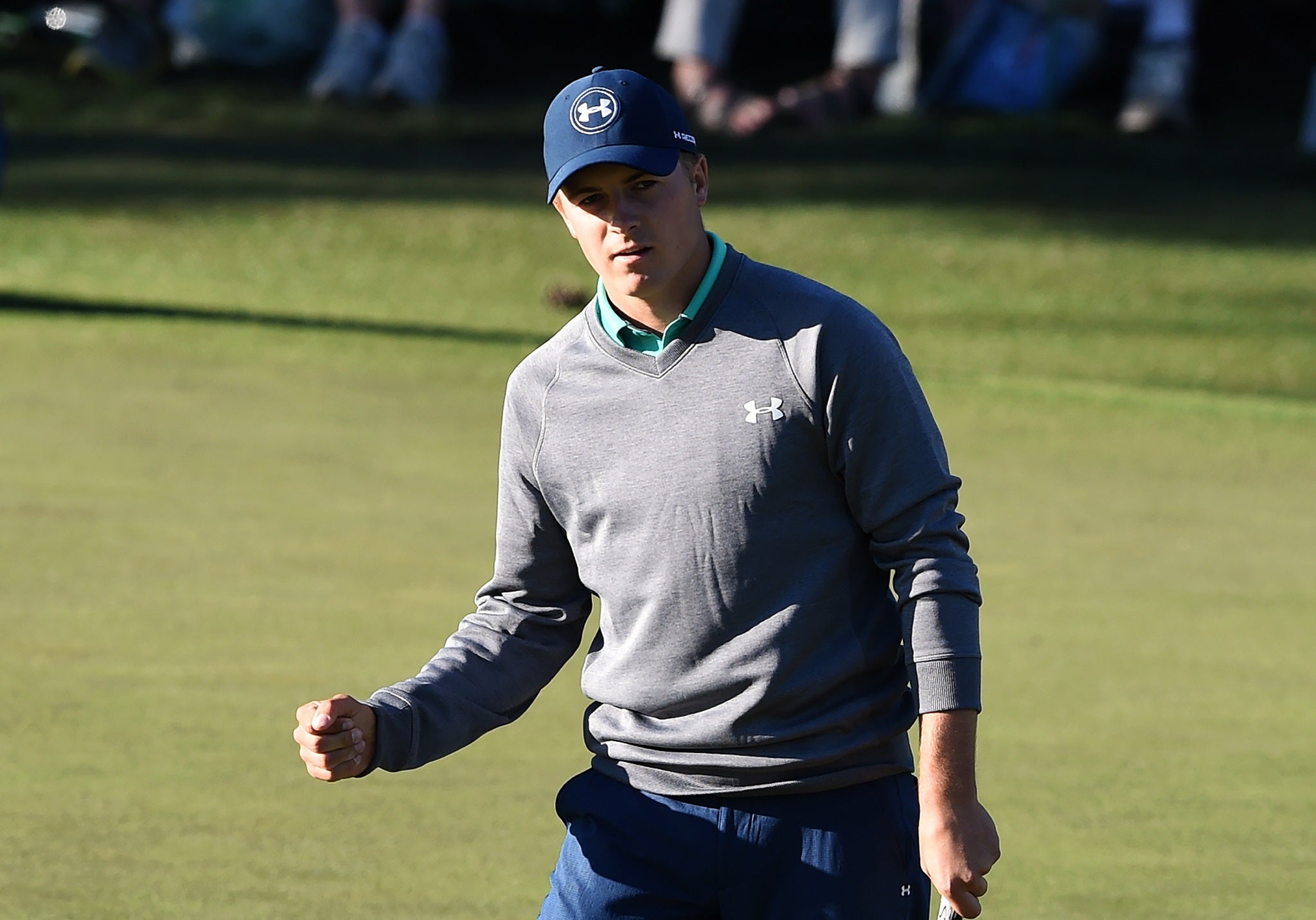 Jordan Spieth celebrates making a birdie putt during the third round of The Masters