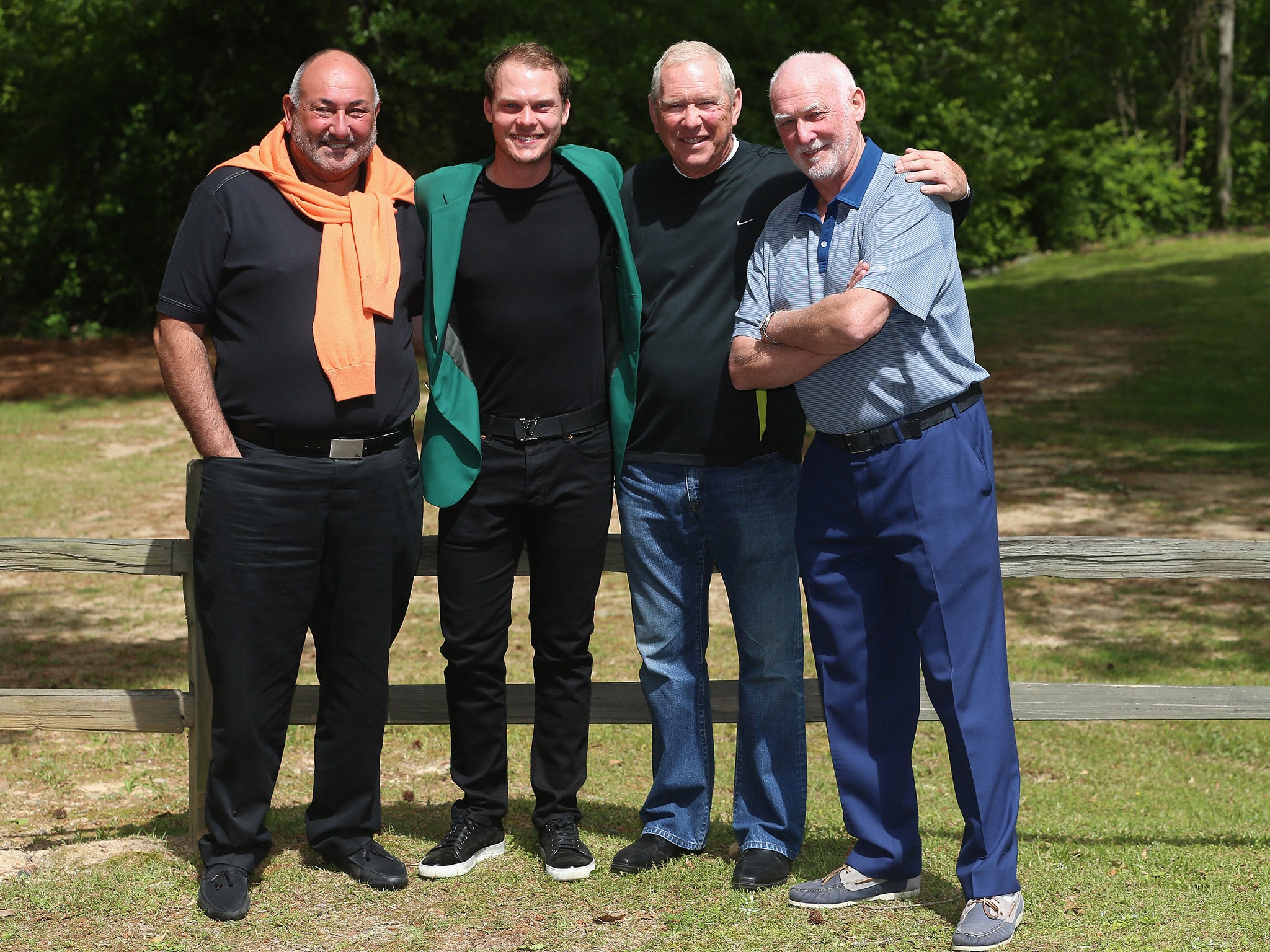 Danny Willett celebrates with his team, including agent Andrew 'Chubby' Chandler (far left)