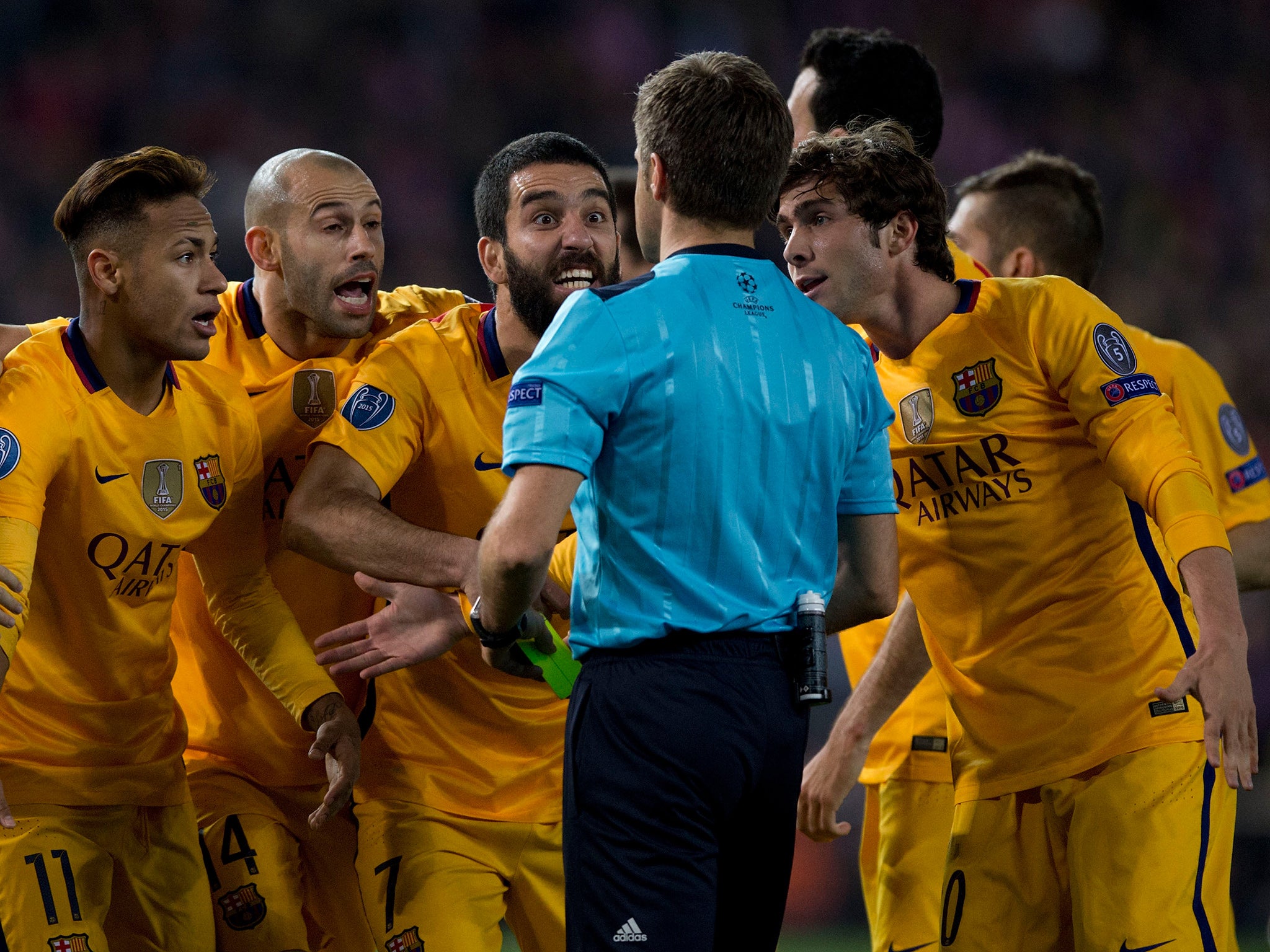Barcelona's players protest a late decision