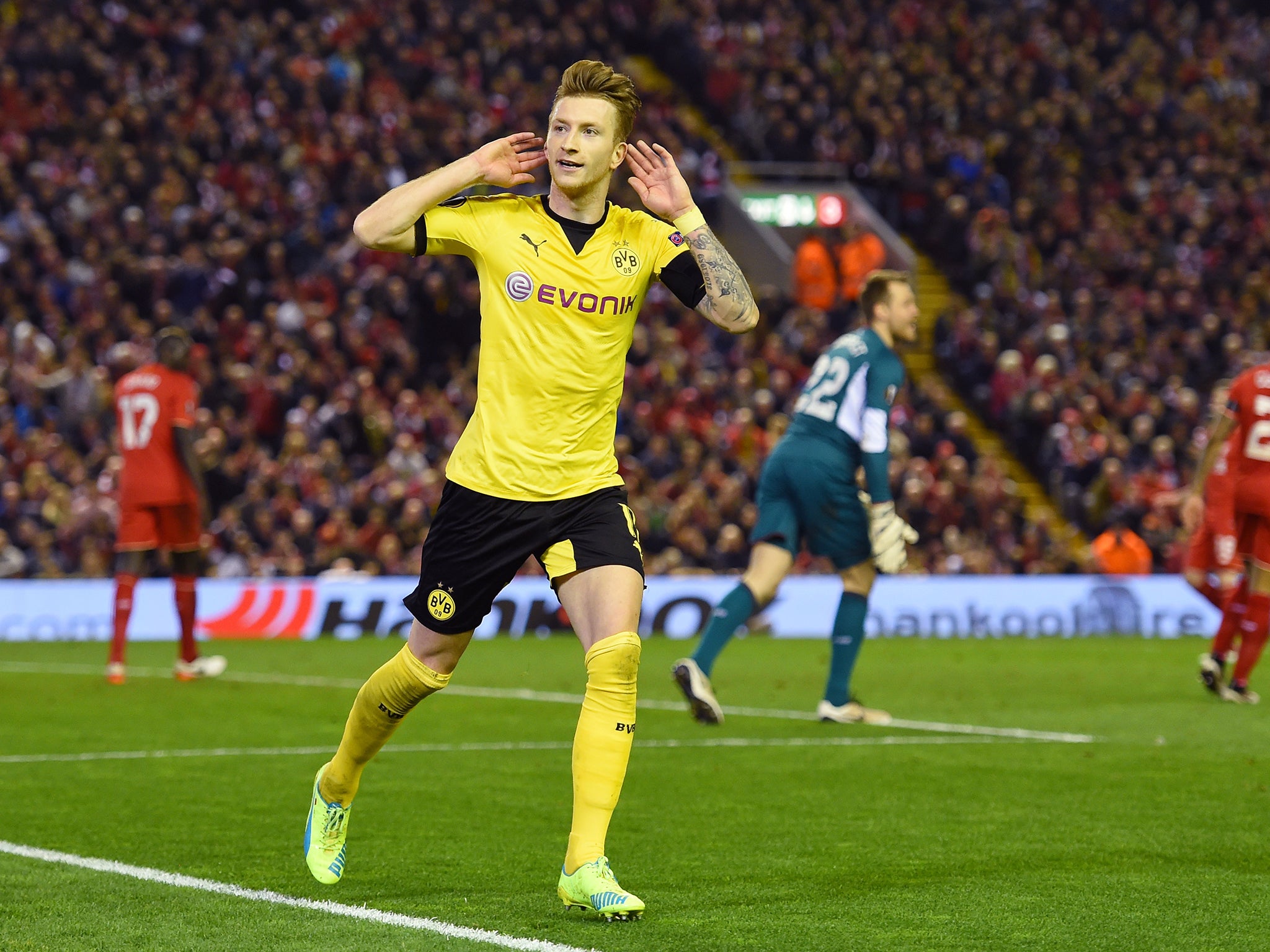 Marco Reus celebrates after making it 3-1 to Dortmund