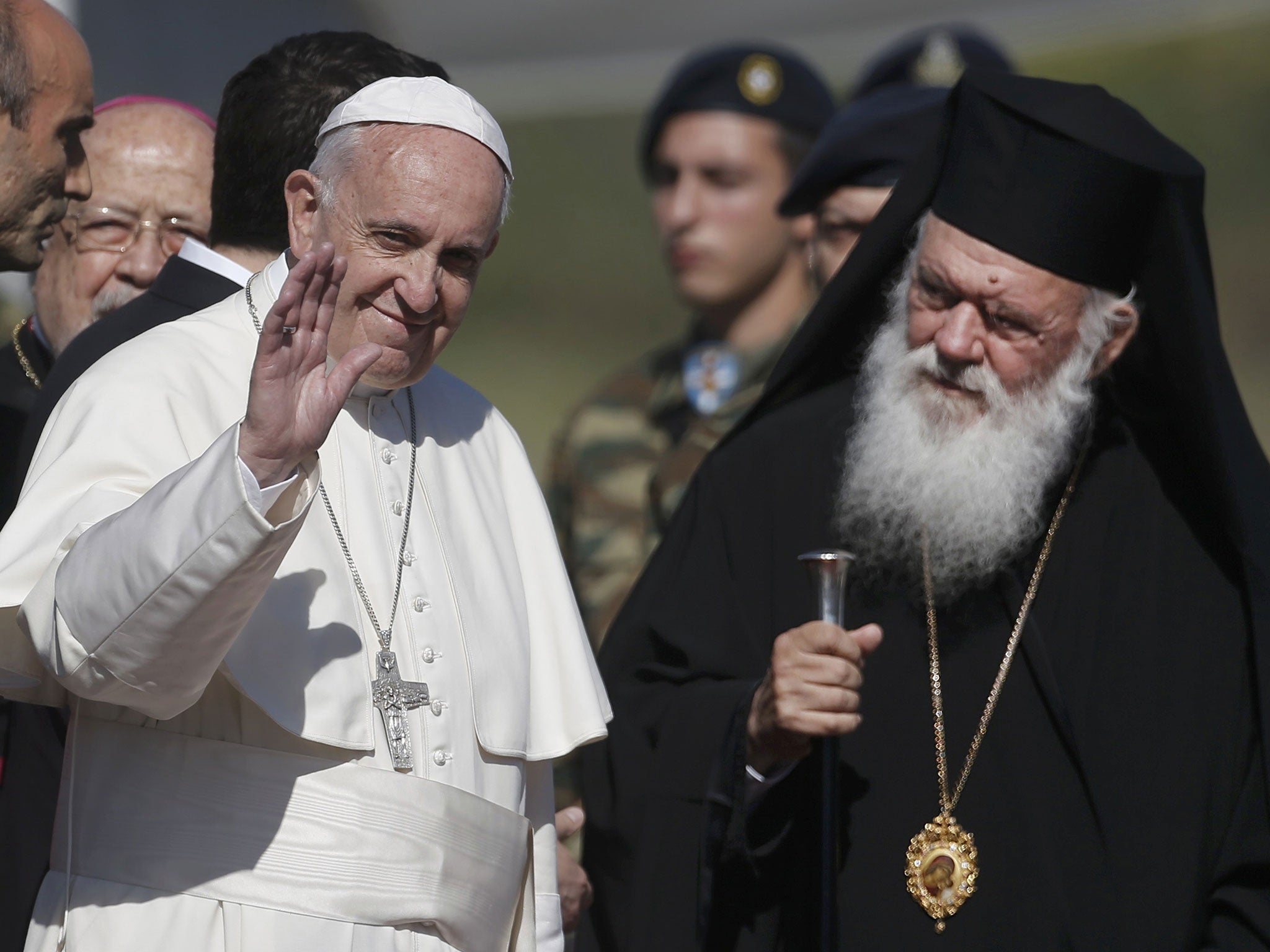 Pope Francis, greeted by Archbishop Ieronimo, arrives on the Greek island of Lesbos on 16 April 2016