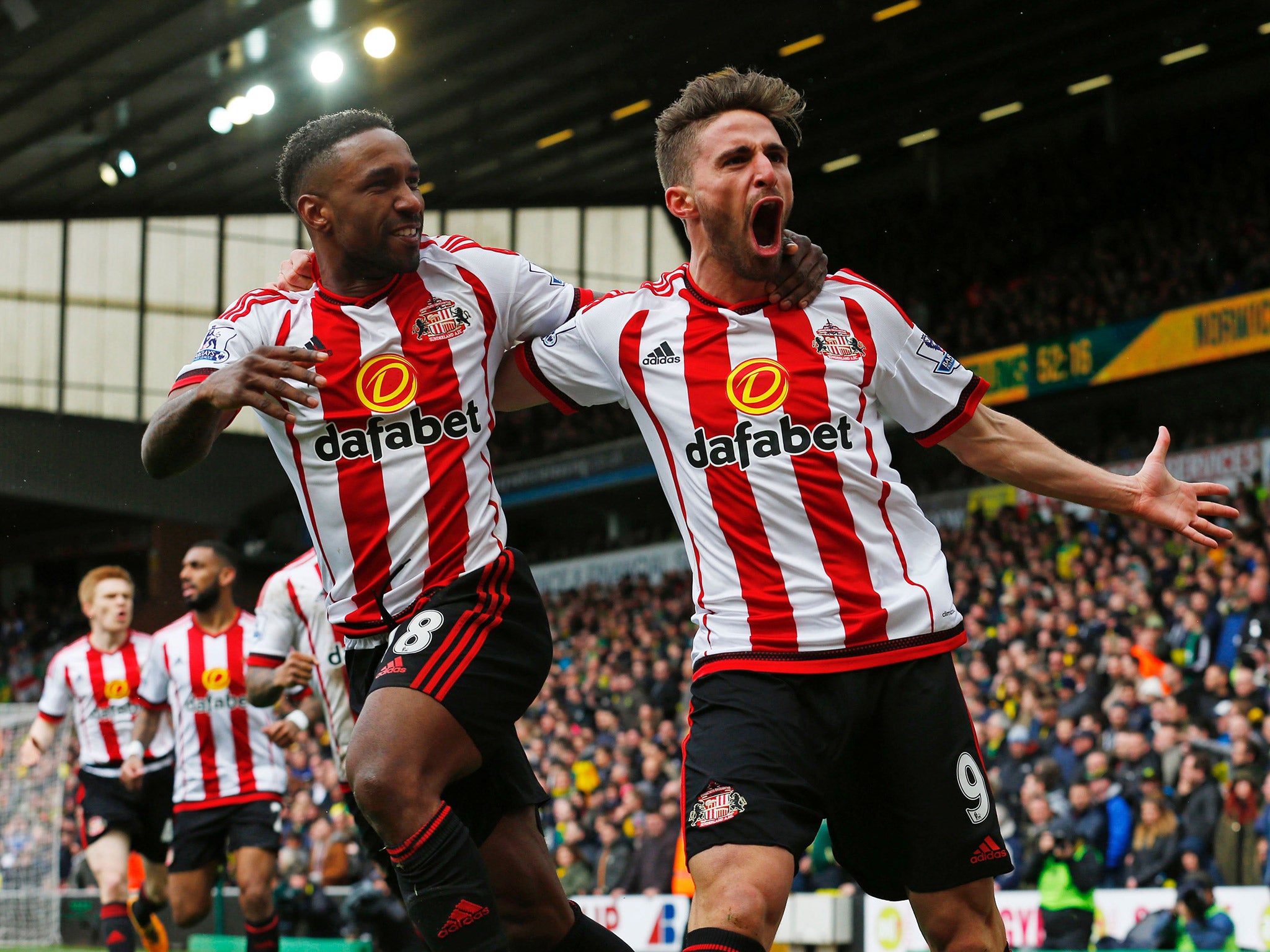 Jermain Defoe celebrates with Fabio Borini after scoring Sunderland's second against Norwich