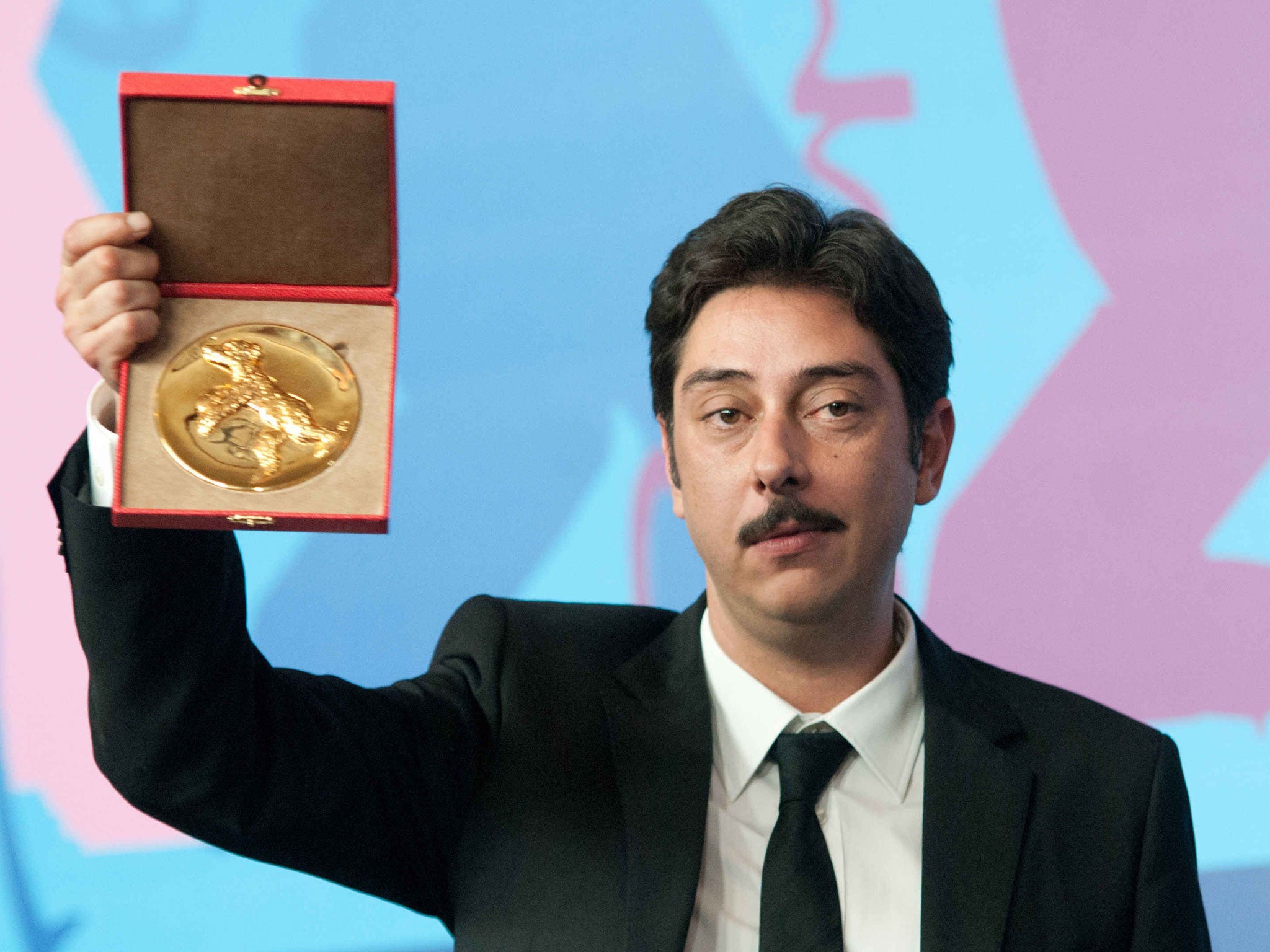 Miguel Gomes is an award-winning director, pictured here with the Alfred Bauer Prize for Artistic Innovation at the 2012 Berlin International Film Festival, which he won for his film 'Tabu'