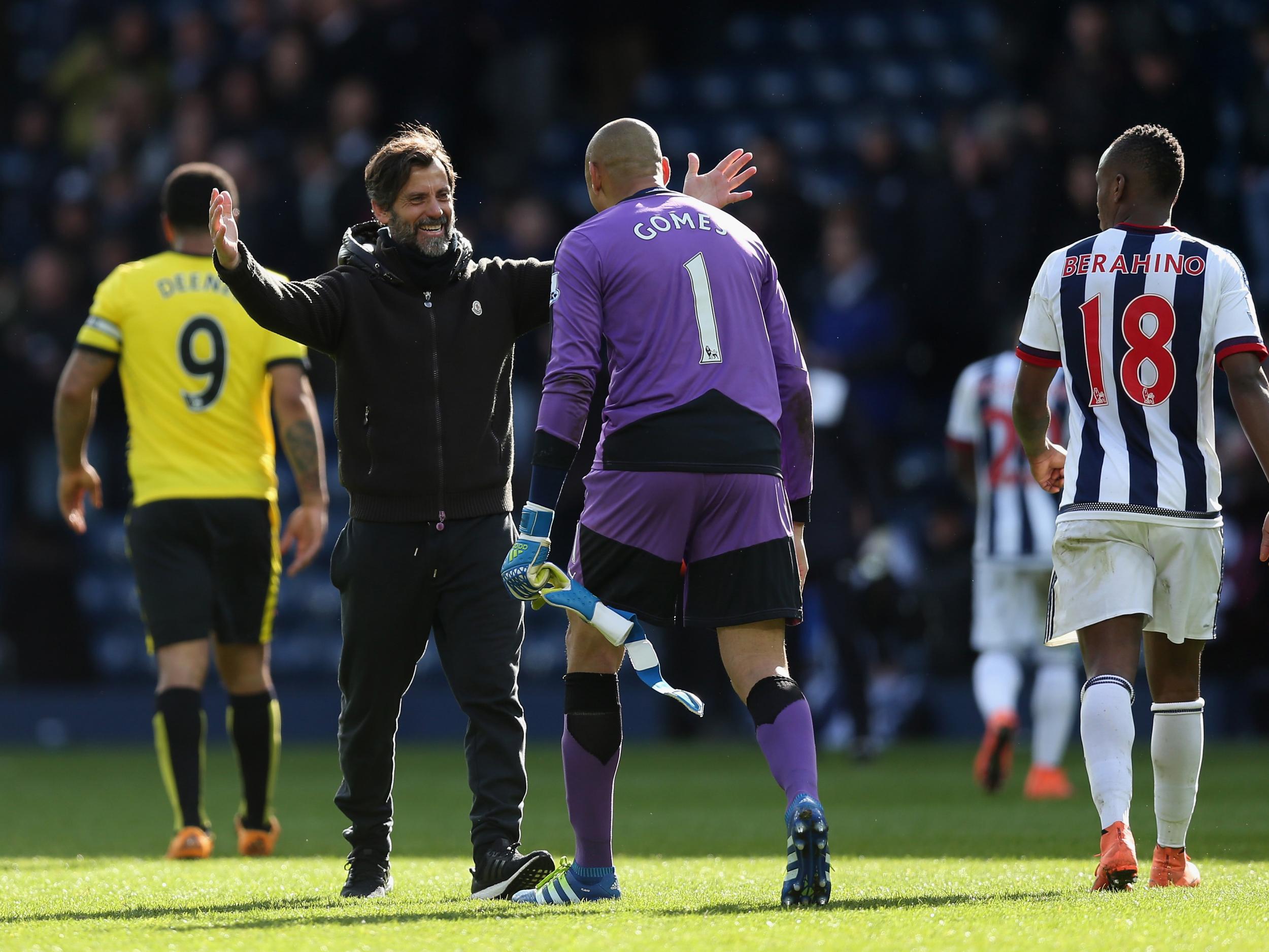 Heurelho Gomes is congratulated by Quique Sanchez Flores after a match-winning display