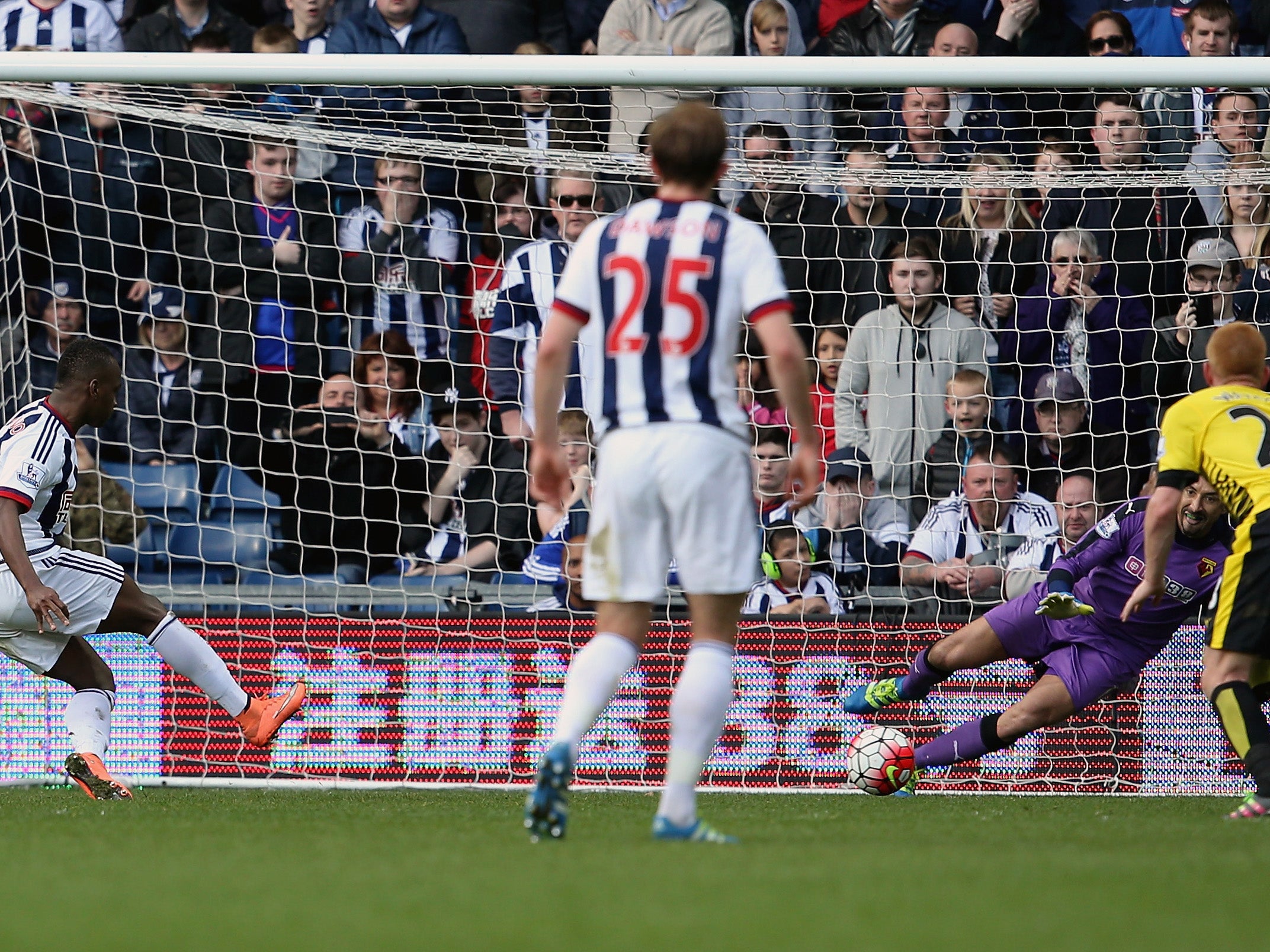 Saido Berahino is denied by Heurelho Gomes from the penalty spot