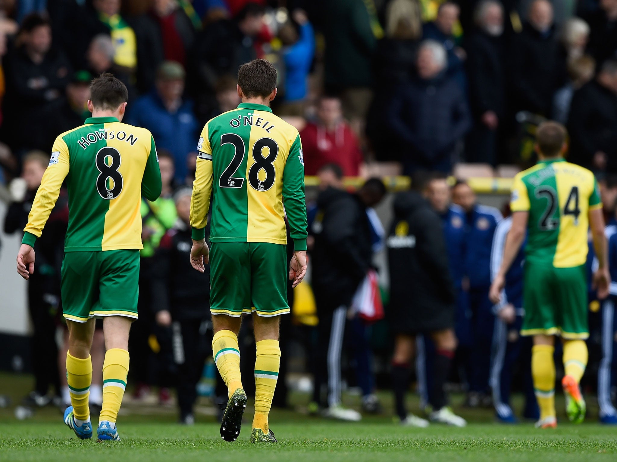 Gary O'Neil and his Norwich team-mates leave the field after defeat to Sunderland