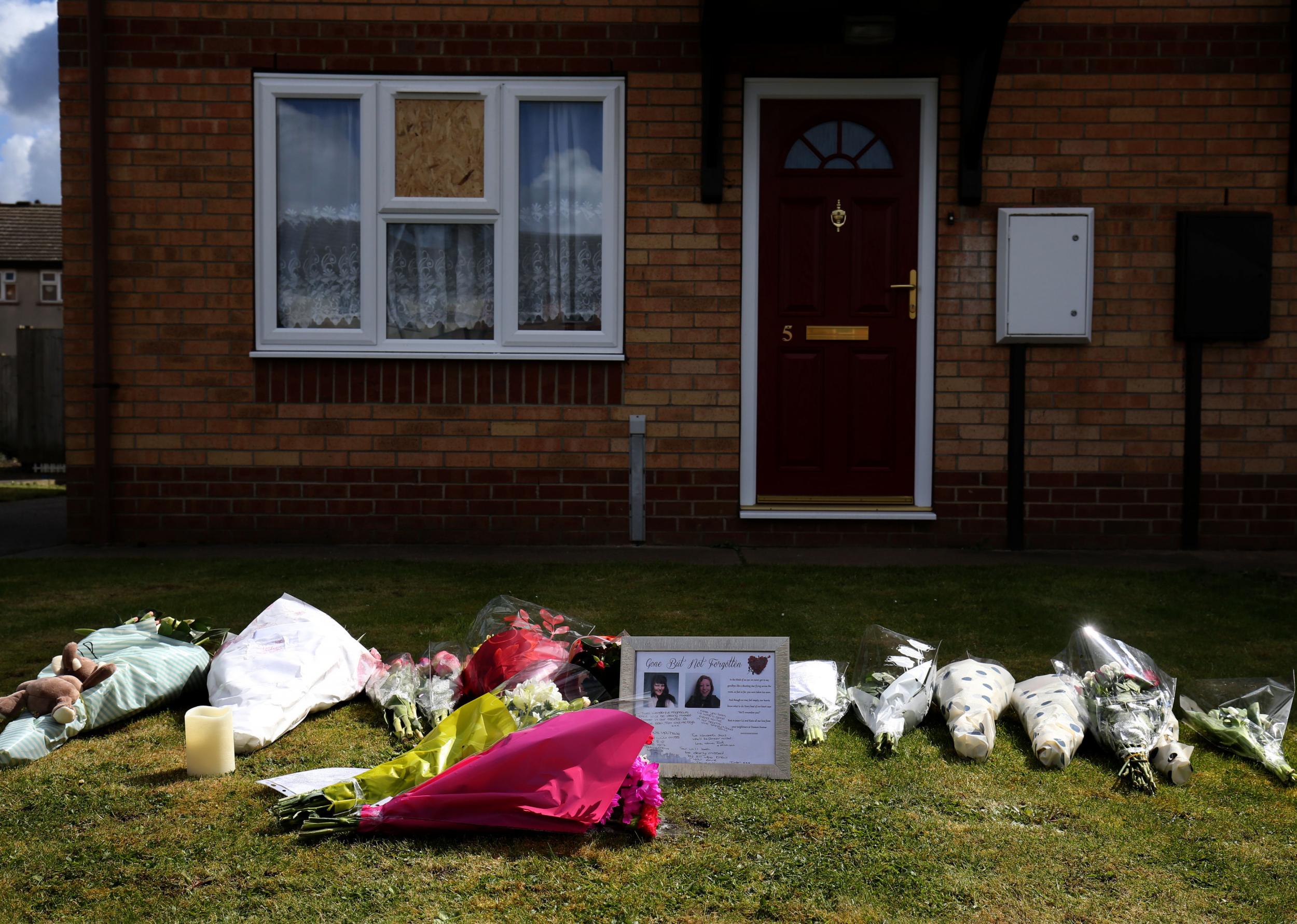 Tributes outside a house in Spalding, Lincolnshire, where the mother and her daughter were found dead