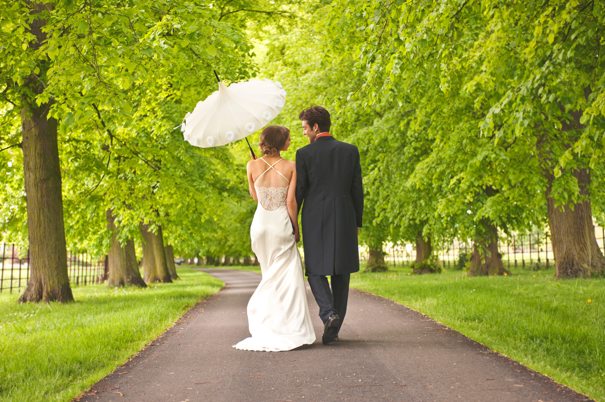 A couple take a stroll in a park