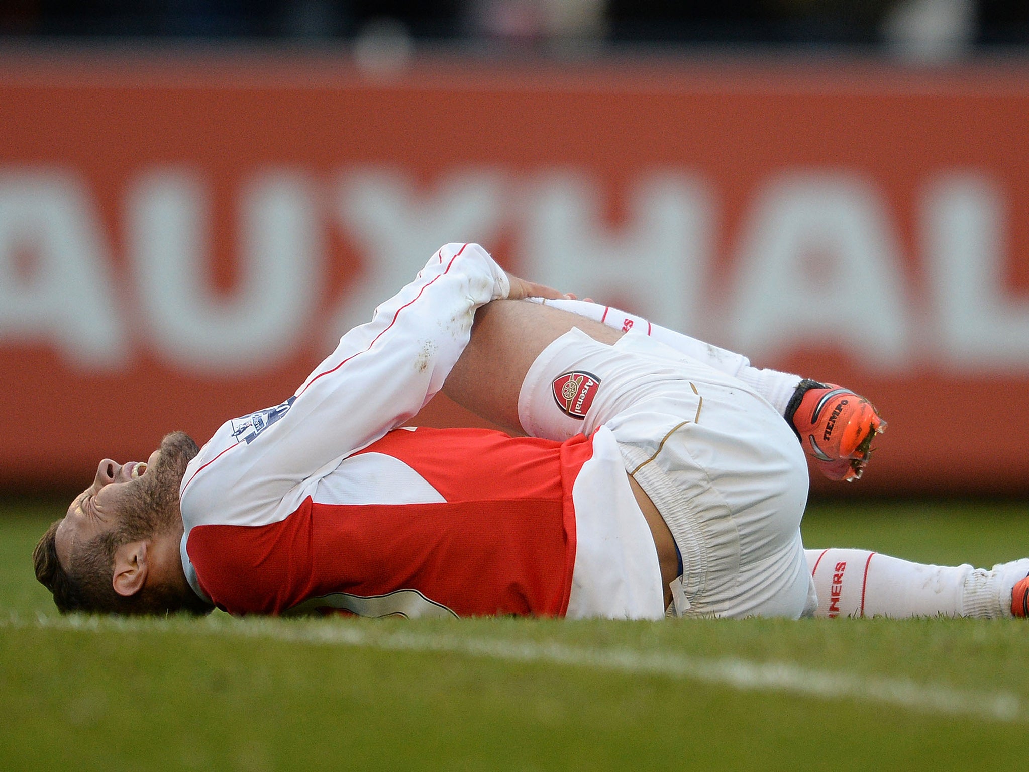 Jack Wilshere went down holding his knee during the first-half