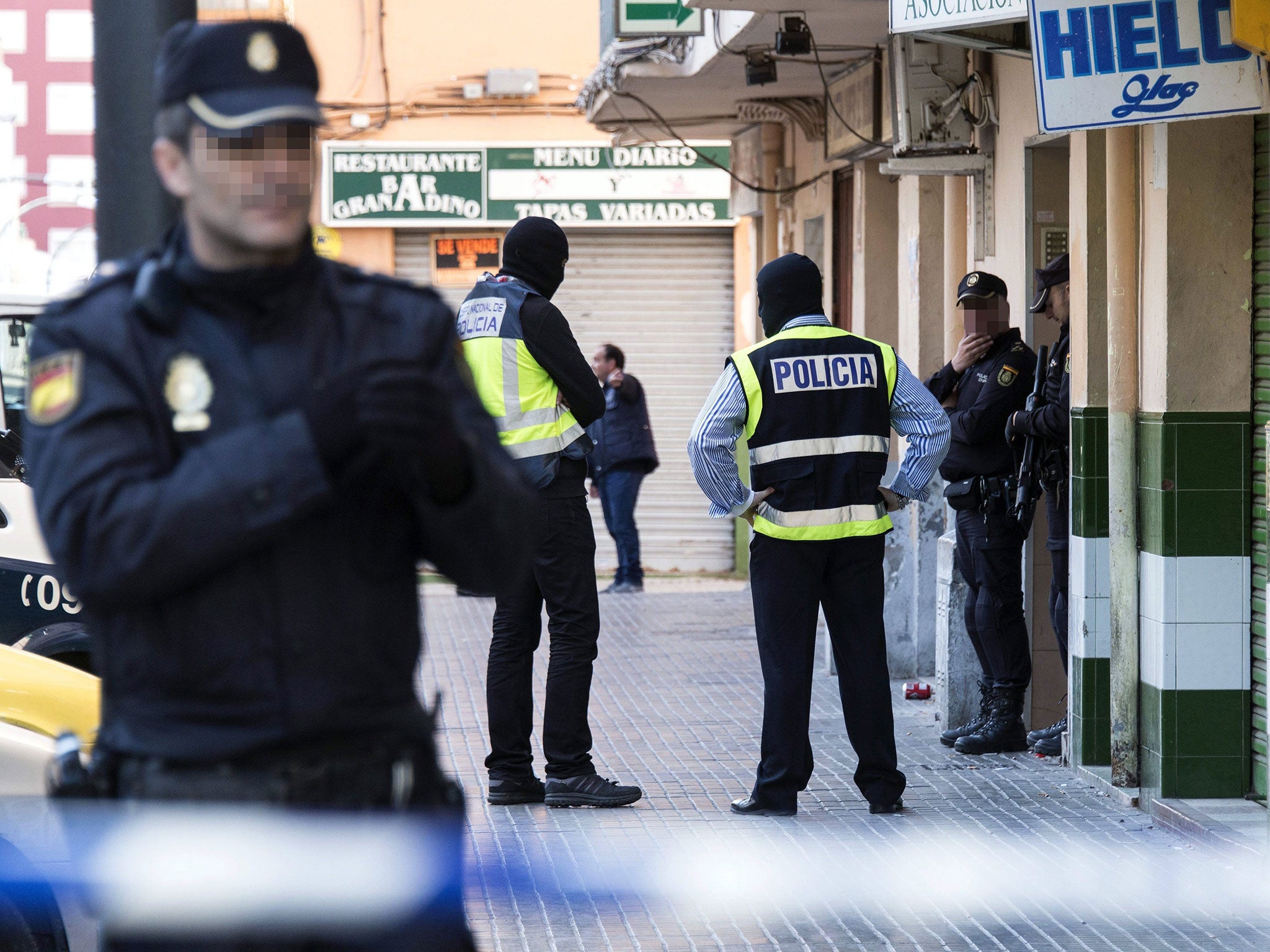 Police secure the flat of a man detained on suspicion of links with Isis in Palma de Mallorca, Spain, on 19 April 2016.