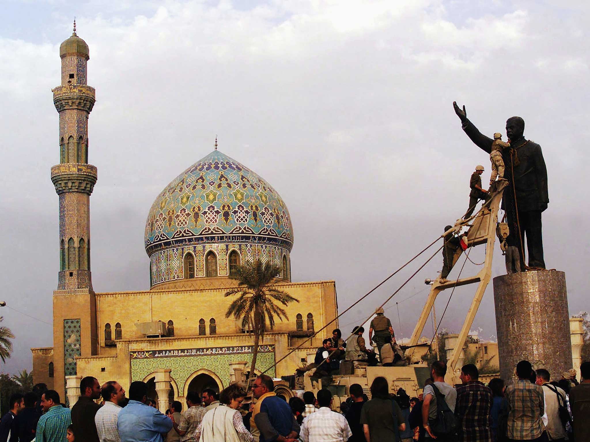 US marines topple the statue of Saddam Hussein in Baghdad, 2003