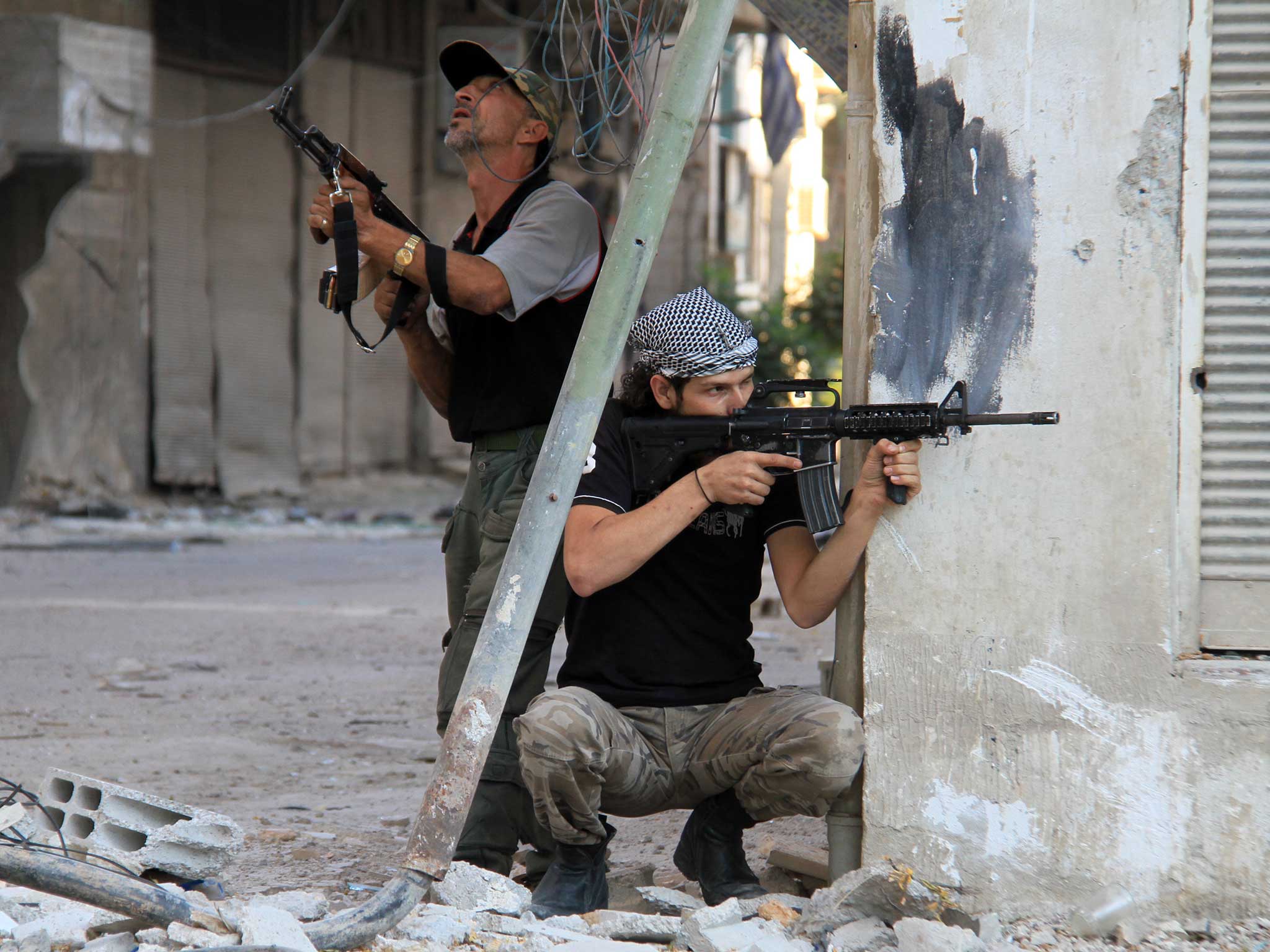 Rebel fighters hold a position on a front line in the Damascus suburb of Yalda, 2013