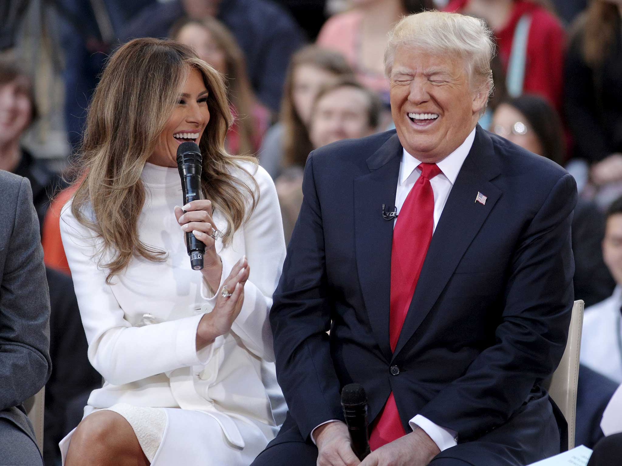 U.S. Republican presidential candidate Donald Trump reacts to an answer his wife Melania gives during an interview on NBC's "Today" show in New York