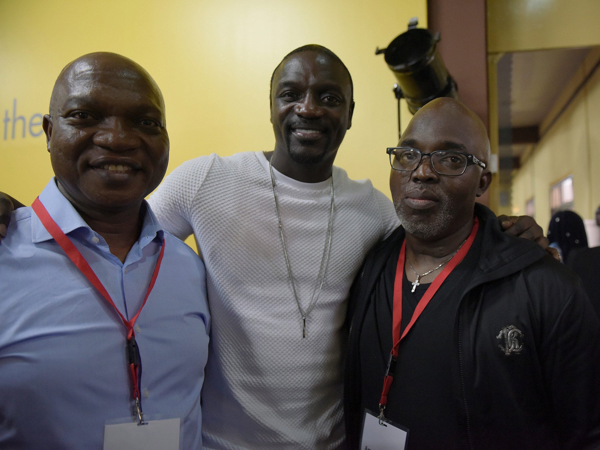 NFF president Amaju Pinnock (right) alongside rapper Akon (centre)