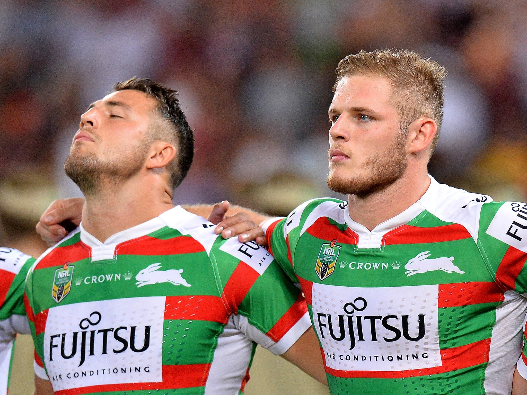 Burgess stands alongside his brother George