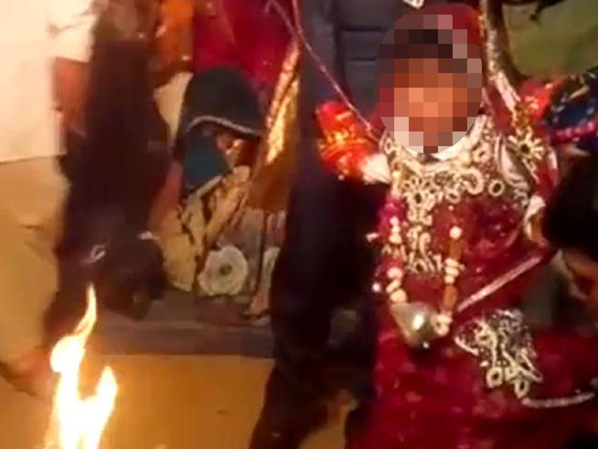 A girl believed to be five years old during a child marriage in Rajasthan, India, in April 2016