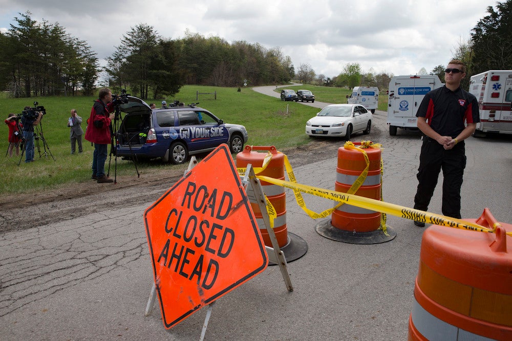 
Emergency and media personnel arrive at Union Hill Road. John Minchillo/Associated Press 