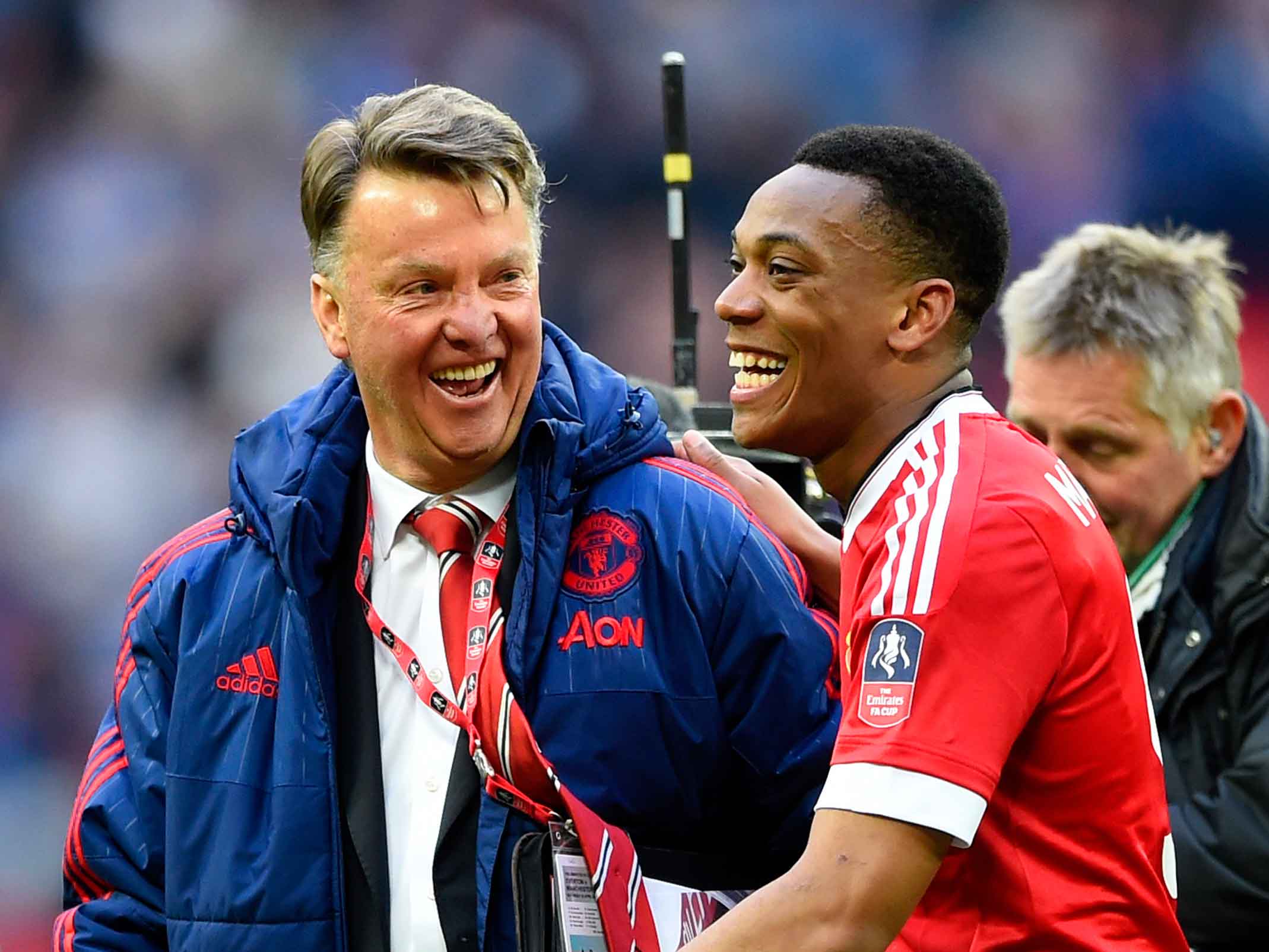 United manager Louis van Gaal celebrates with Anthony Martial