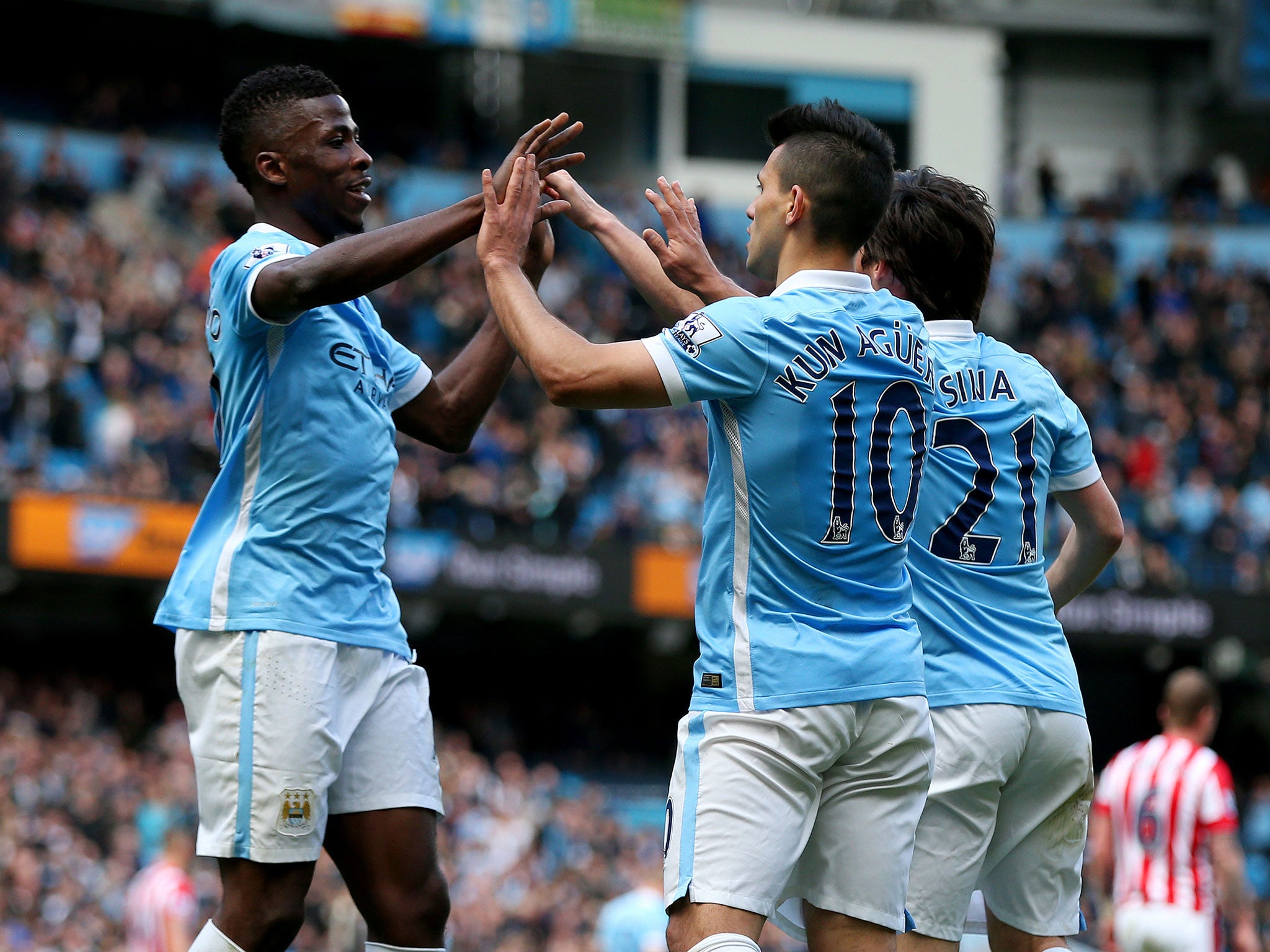 Sergio Aguero of Manchester City celebrates with team mates, David Silva and Kelechi Iheanacho