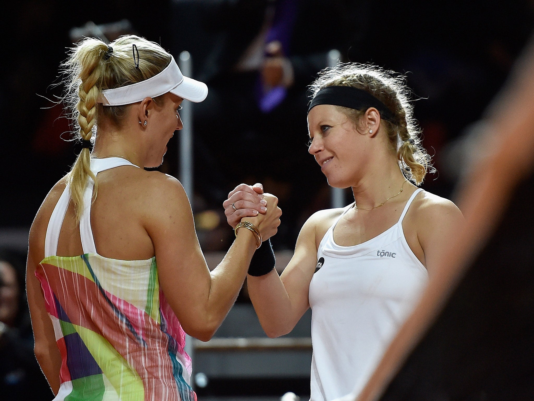 Angelique Kerbe shakes hands with Laura Siegeman