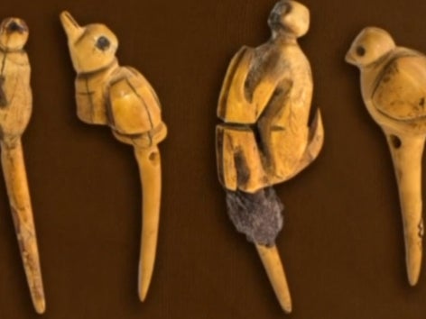 Archaeologists found four carved bone broaches with bird and monkey motifs