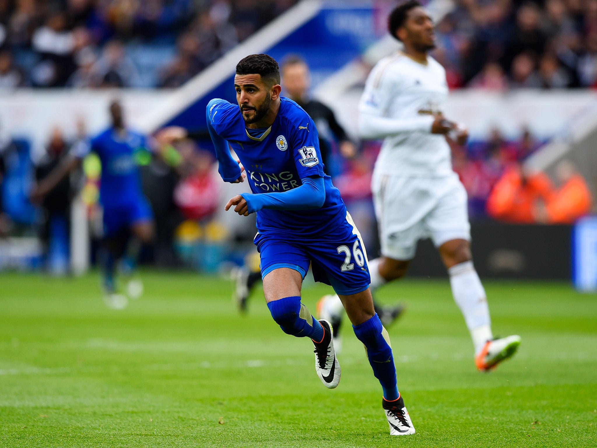 Riyad Mahrez celebrates after scoring the opener against Swansea