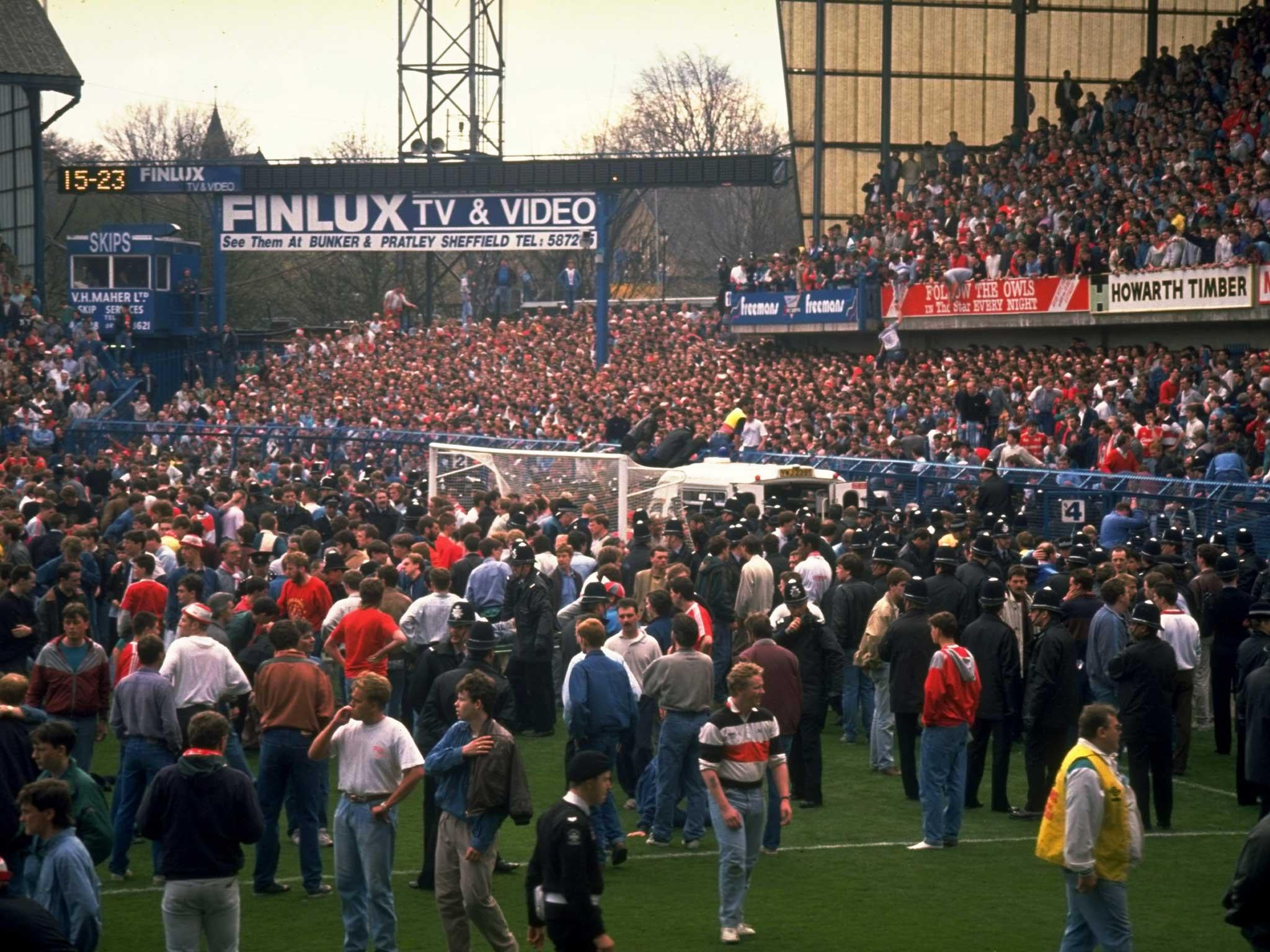 Supporters are crushed against the barrier as disaster strikes before the FA Cup semi-final match between Liverpool and Nottingham Forest played at the Hillsborough Stadium in Sheffield, 1989