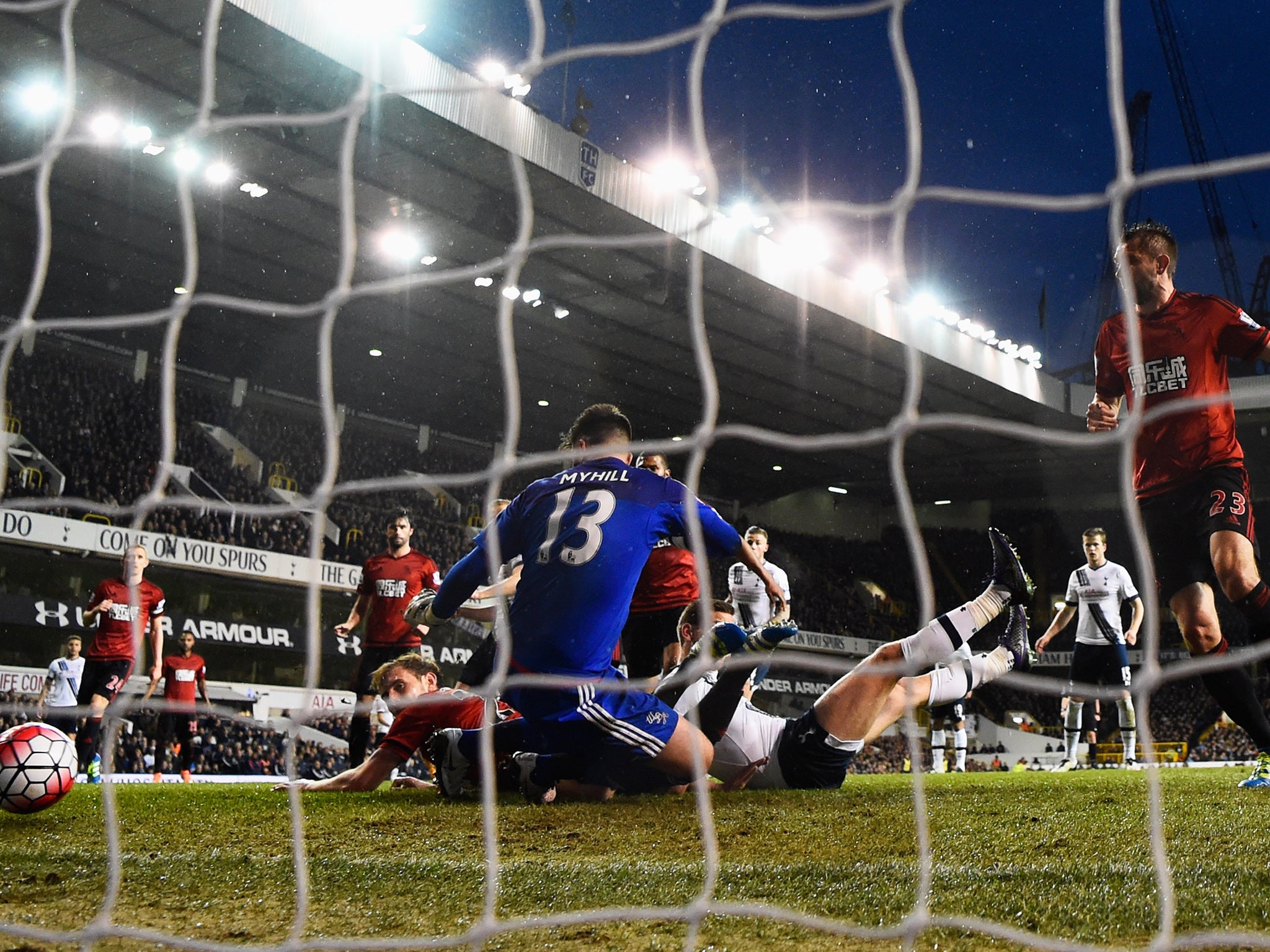 Craig Dawson bundles the ball into his own net