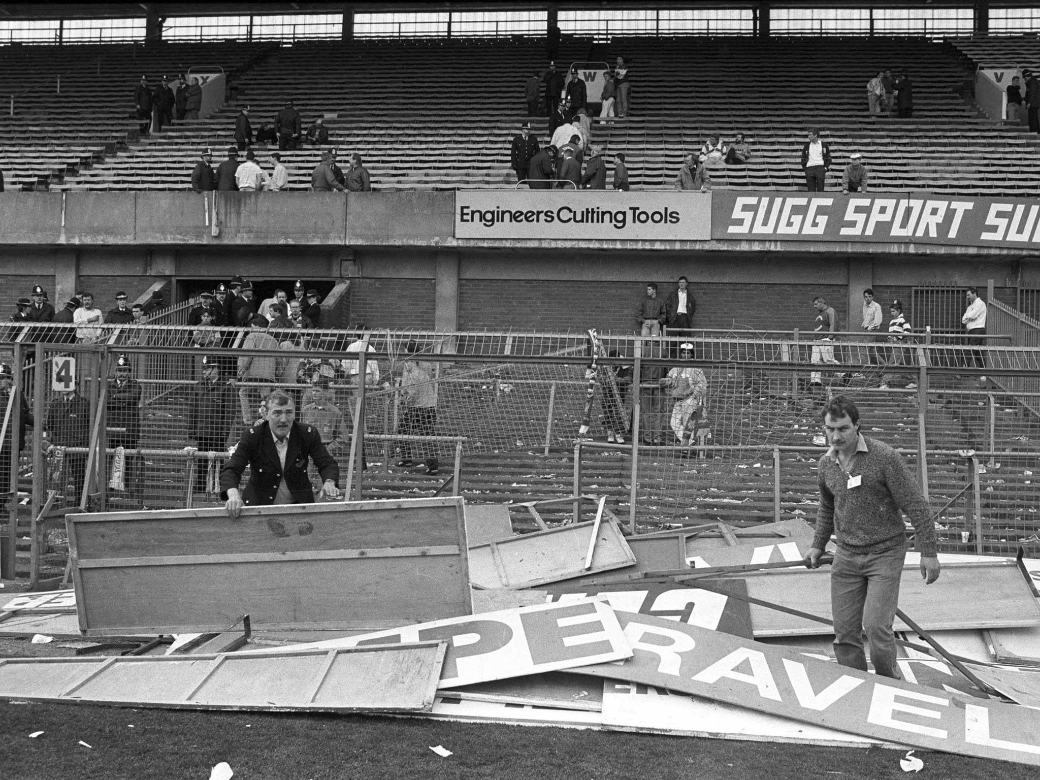 Advertising boards which were used as stretchers, are piled up following the overcrowding at the 1989 FA Cup semi-final at Hillsborough