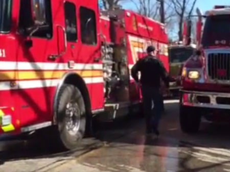 Firefighers attend the blaze in Montville, Connecticut