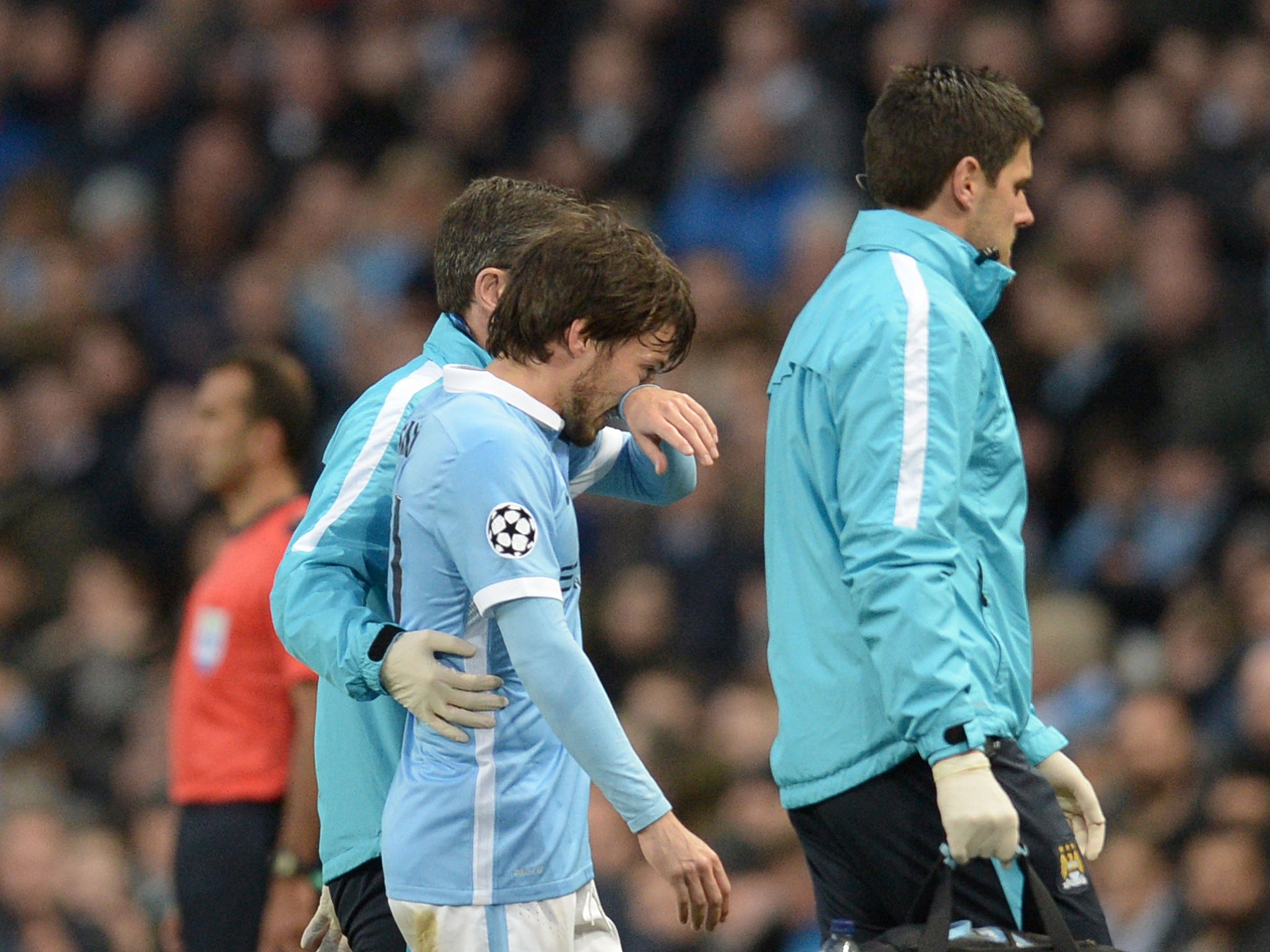 Injured David Silva leaves the field