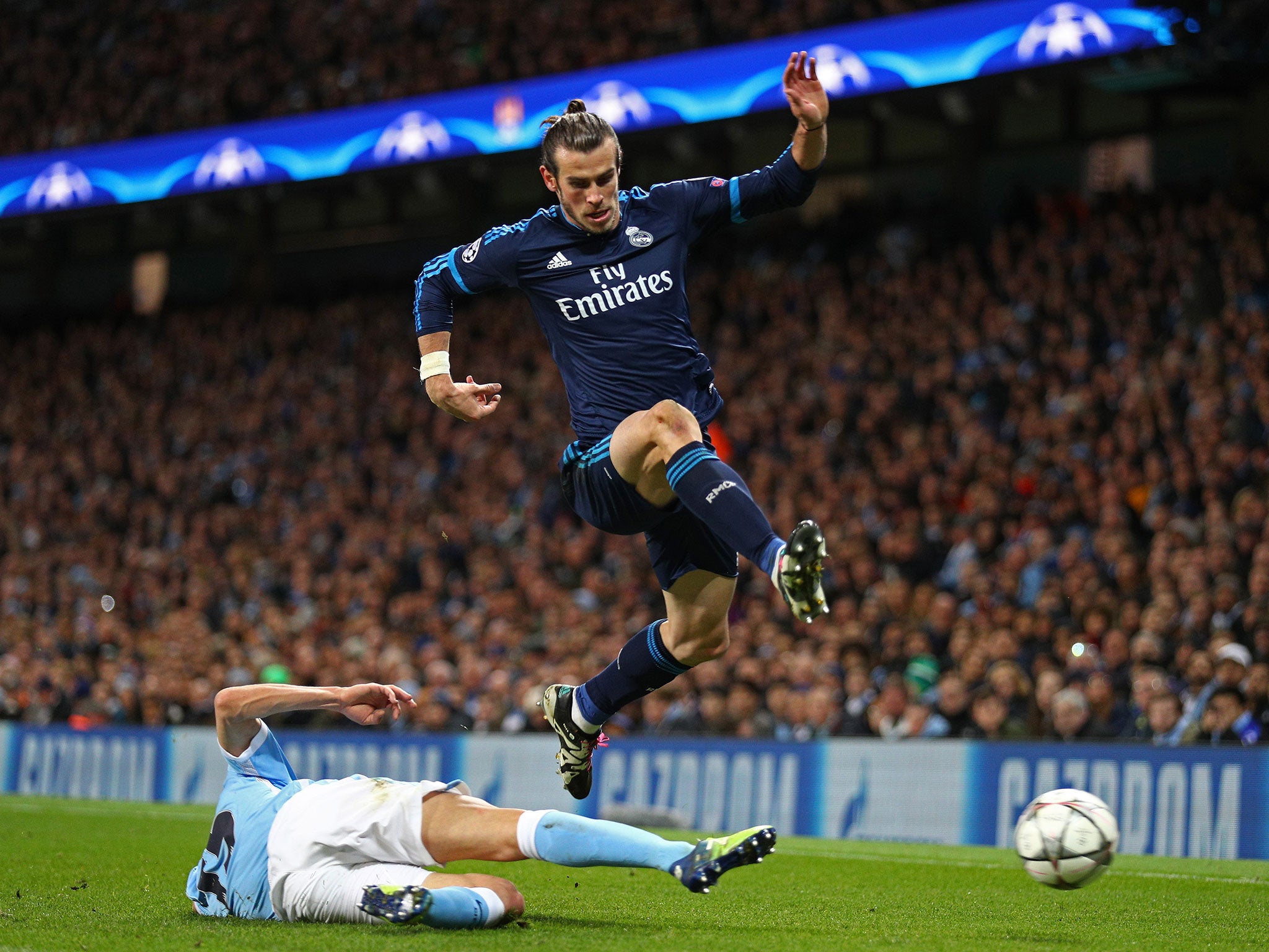 Gareth Bale competes for the ball